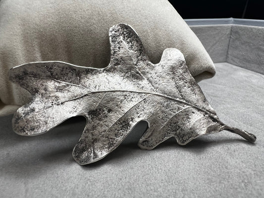 Shaped like an oak leaf, this sterling silver brooch captures nature’s beauty in exquisite detail. Its realistic design makes it a standout piece wherever it’s worn.