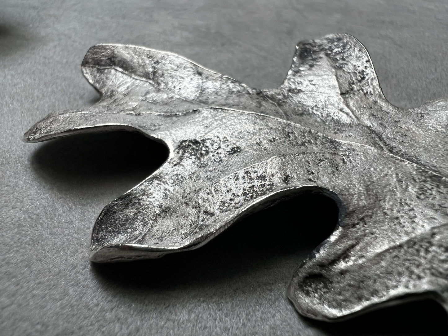 Shaped like an oak leaf, this sterling silver brooch captures nature’s beauty in exquisite detail. Its realistic design makes it a standout piece wherever it’s worn.