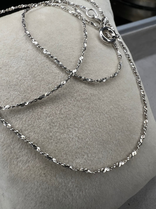 Crafted from sterling silver by Danecraft, a trusted jewelry company, this is a petite but strong chain. It can be worn solo or you can pair with one of our small sterling pendants.