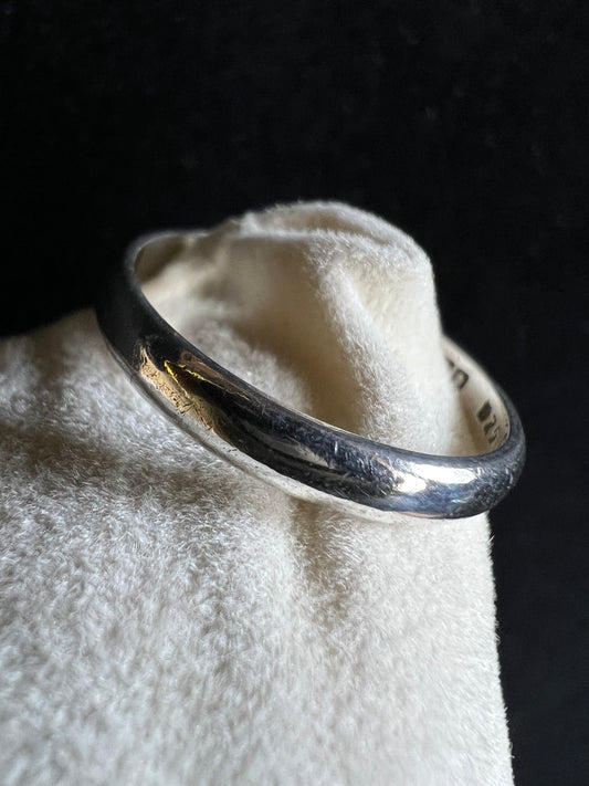 This classic vintage ring, crafted from sterling silver, offers elegance in its simplicity. Signed Mexico.