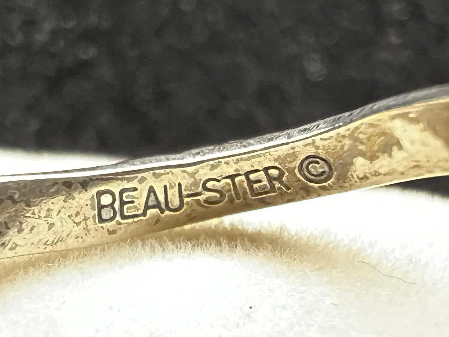 This Beau Sterling ring features a snake design that coils gracefully around your finger. This expertly detailed piece combines artistry and symbolism, offering a bold yet elegant accessory that will enhance any jewelry collection.