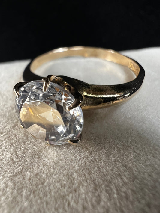 This gold-filled ring with a beautiful clear white spinel is fine piece of jewelry, as well as an affordable alternative to a diamond ring.