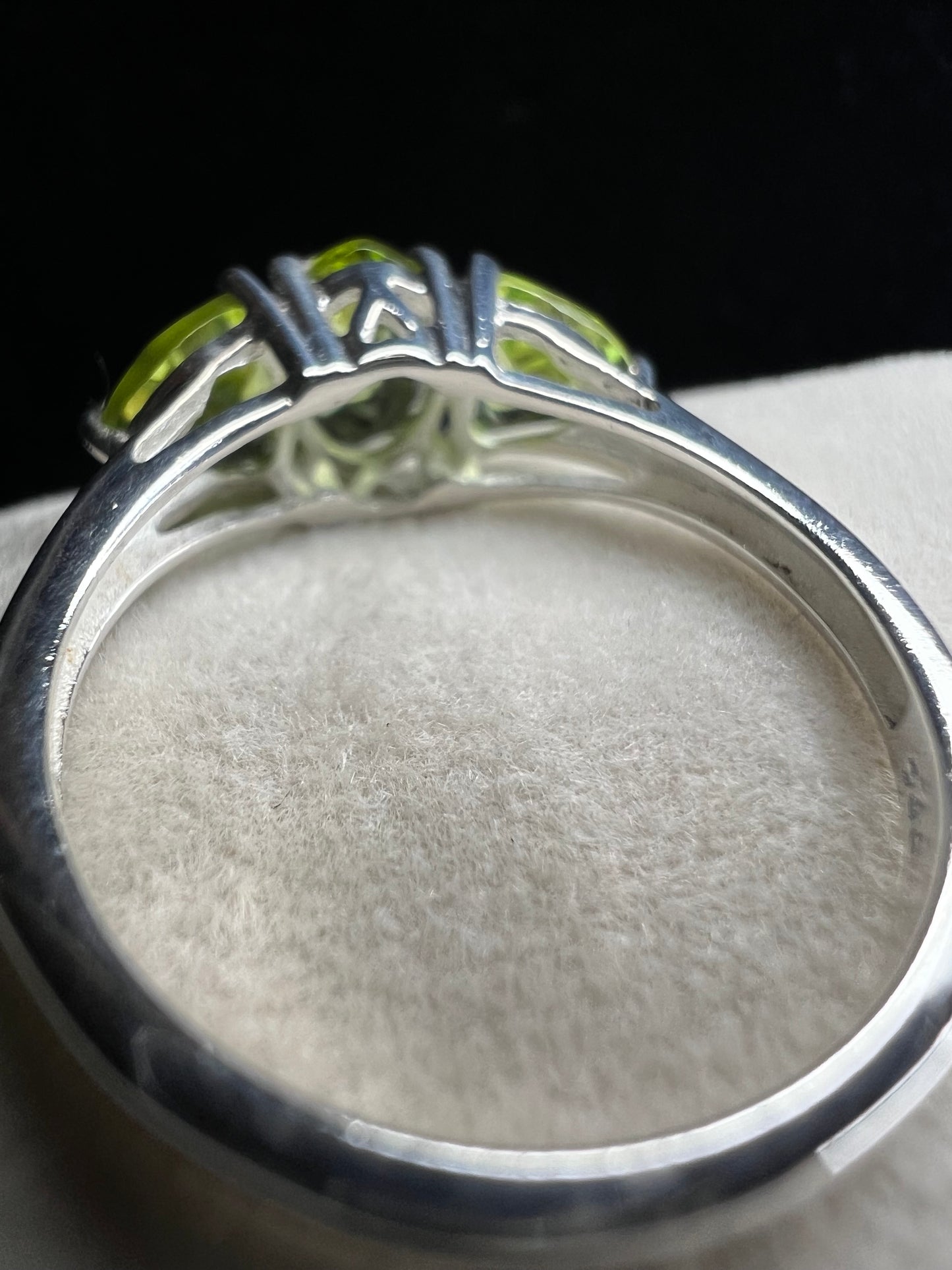 Three peridot stones front and center make this a special ring. Crafted from sterling silver, this piece is perfect when your outfit needs a spark. The cut, color and design of these stones will not disappoint.