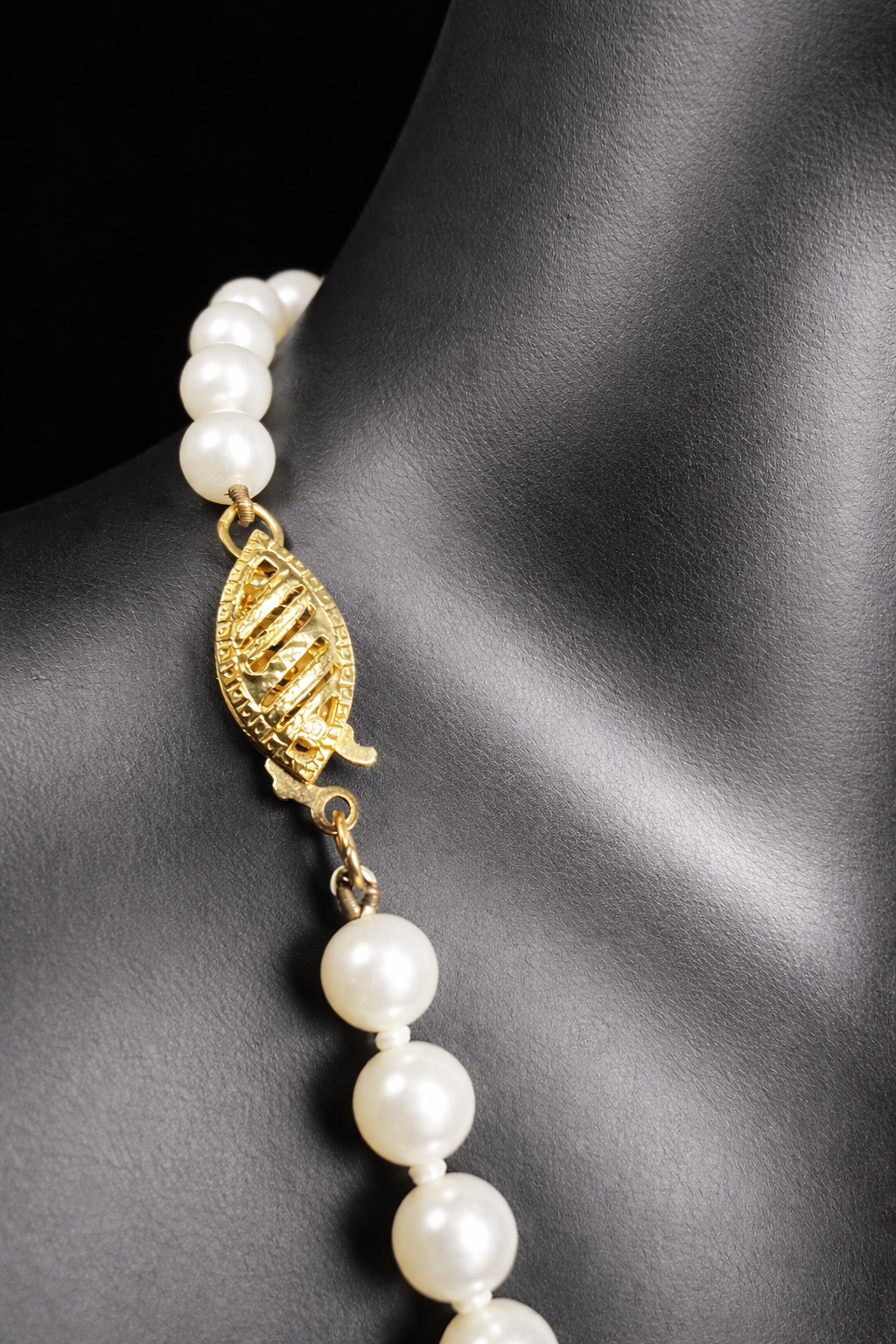 This designer necklace features cultured pearls and a detailed 14k gold clasp. Signed RAFKA, this necklace could be just what you're looking for. Perfect for any season.