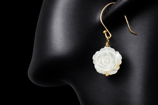 This stunning pair of earrings features a mother of pearl rose on each with gold washed sterling silver.