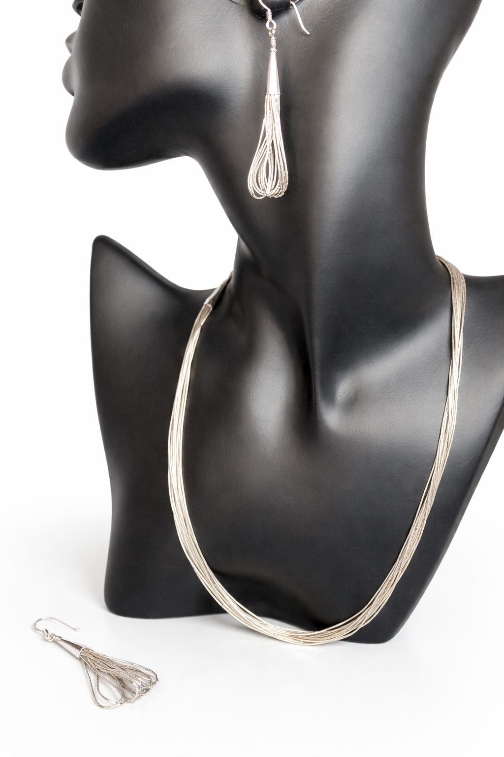 Crafted from sterling silver, this vintage necklace and earrings set seamlessly bridges classic elegance and contemporary style. Whether you're embracing full vintage aesthetics or seeking a distinctive accent for modern pieces, this set delivers timeless appeal with everyday versatility.