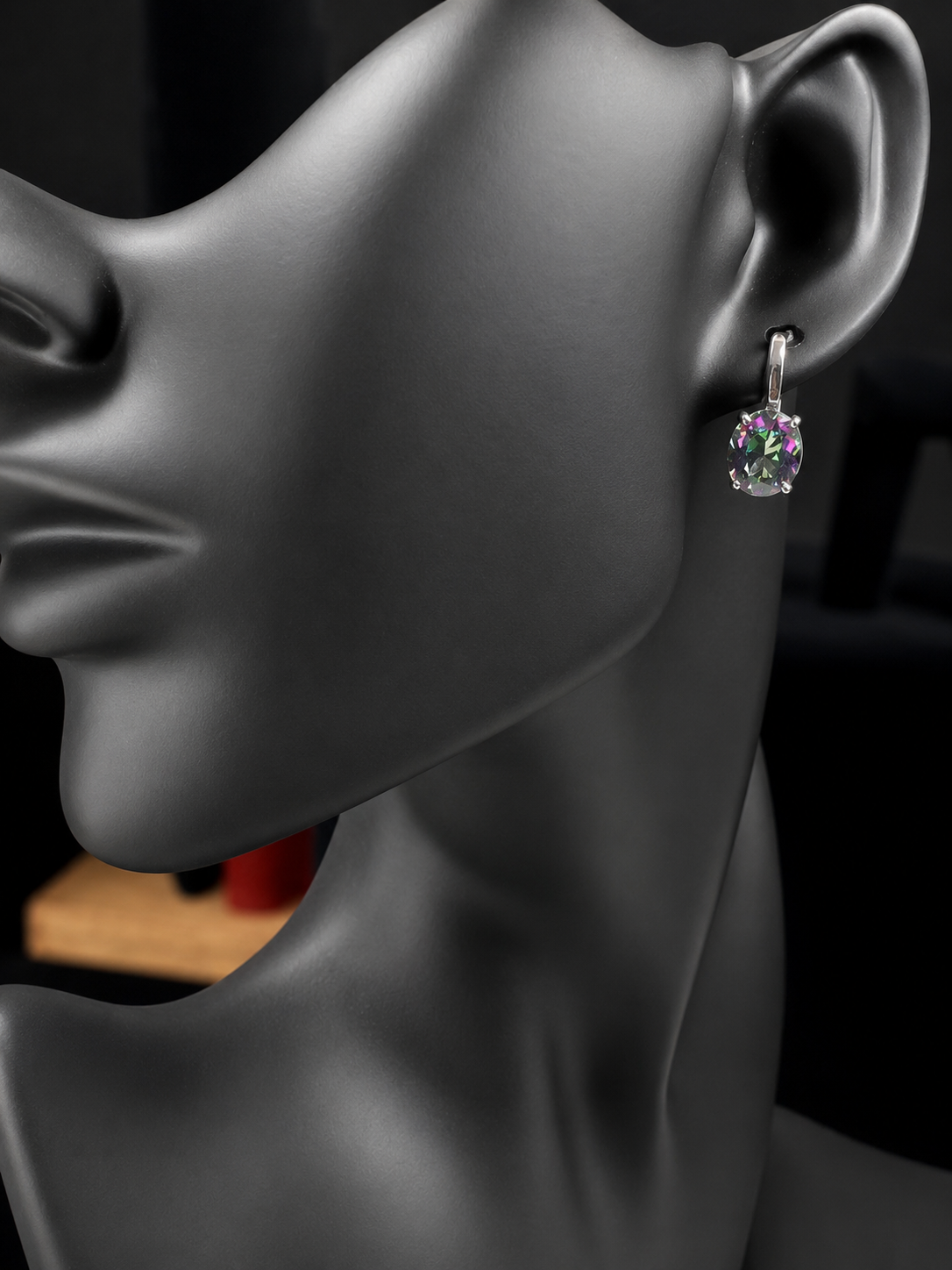 Elevate your everyday elegance with these stunning sterling silver mystic topaz earrings. Each piece showcases a radiant lab-created mystic topaz stone measuring 10 mm x 8 mm, displaying mesmerizing rainbow hues that catch the light beautifully. Crafted from genuine sterling silver, these earrings offer a perfect balance of sophistication and eye-catching sparkle.