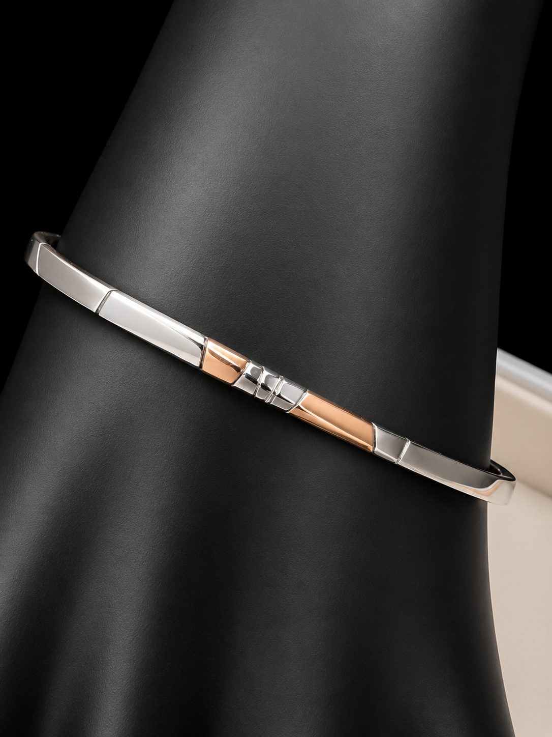 Here is an elegant vintage sterling silver bracelet featuring inlaid copper accents and hand-etched detailing. The distinctive rectangular design creates a modern yet timeless aesthetic, making this piece a standout addition to any jewelry collection.