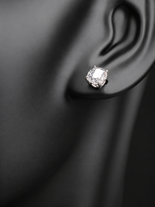 These sterling silver and CZ earrings combine timeless elegance with modern sparkle. Each piece features a generous 6 mm cubic zirconia stone set in premium sterling silver, delivering brilliant shine at a fraction of the cost of diamonds. Perfect for everyday wear or special occasions, these earrings offer versatile style that complements any wardrobe.