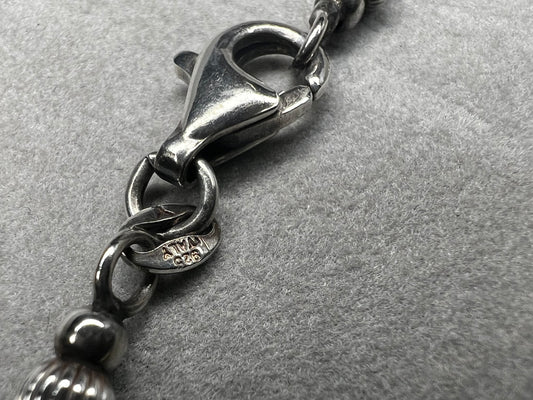 Made of sterling silver beads with alternating gold overlay, this is a nice short necklace that needs no pendant.
