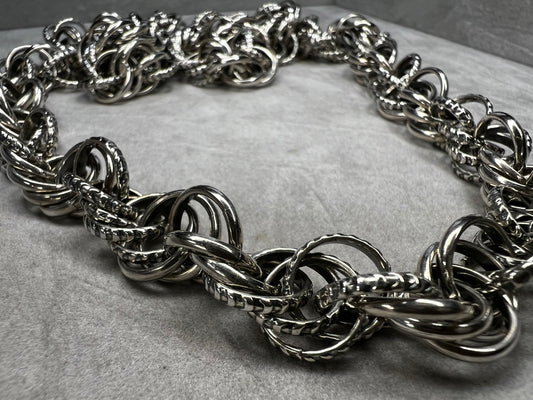 Large enough to fit over your head, this chain has no clasp -- ensuring a long-lasting piece of jewelry. It is a solid, heavy, well-made and detailed chain.