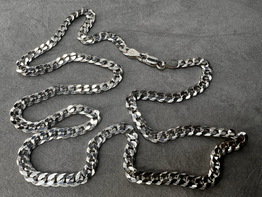 This 24" sterling silver Cuban link chain features a high polish finish that adds a sleek, timeless shine. Its sturdy yet elegant design makes it a versatile accessory, perfect for everyday wear or pairing with your favorite pendant.