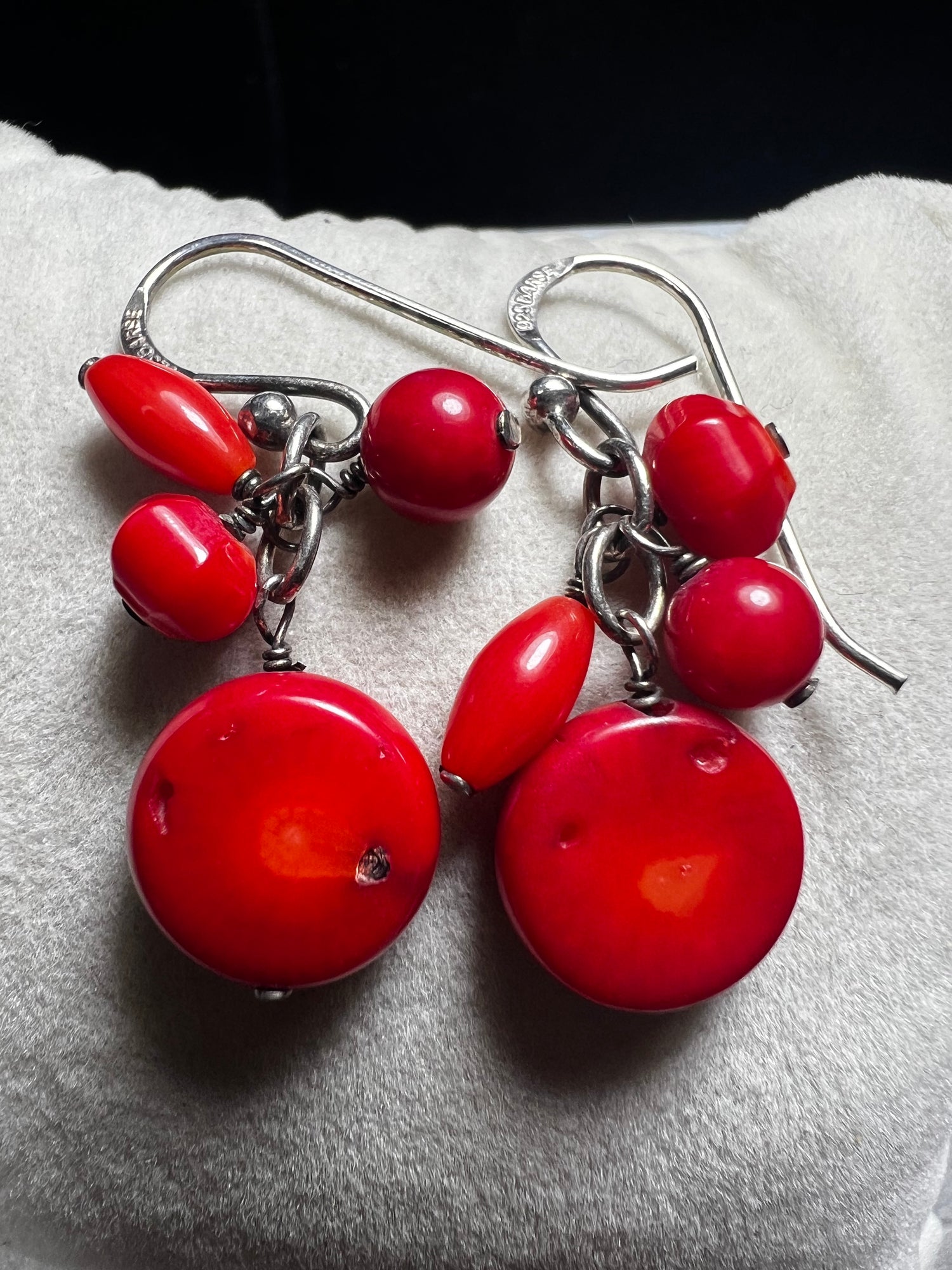 These Barse Jewelry earrings feature vibrant red coral set in sterling silver, combining natural beauty with expert craftsmanship. Their striking color and refined design make them a good choice for adding a bold yet elegant touch to any outfit.