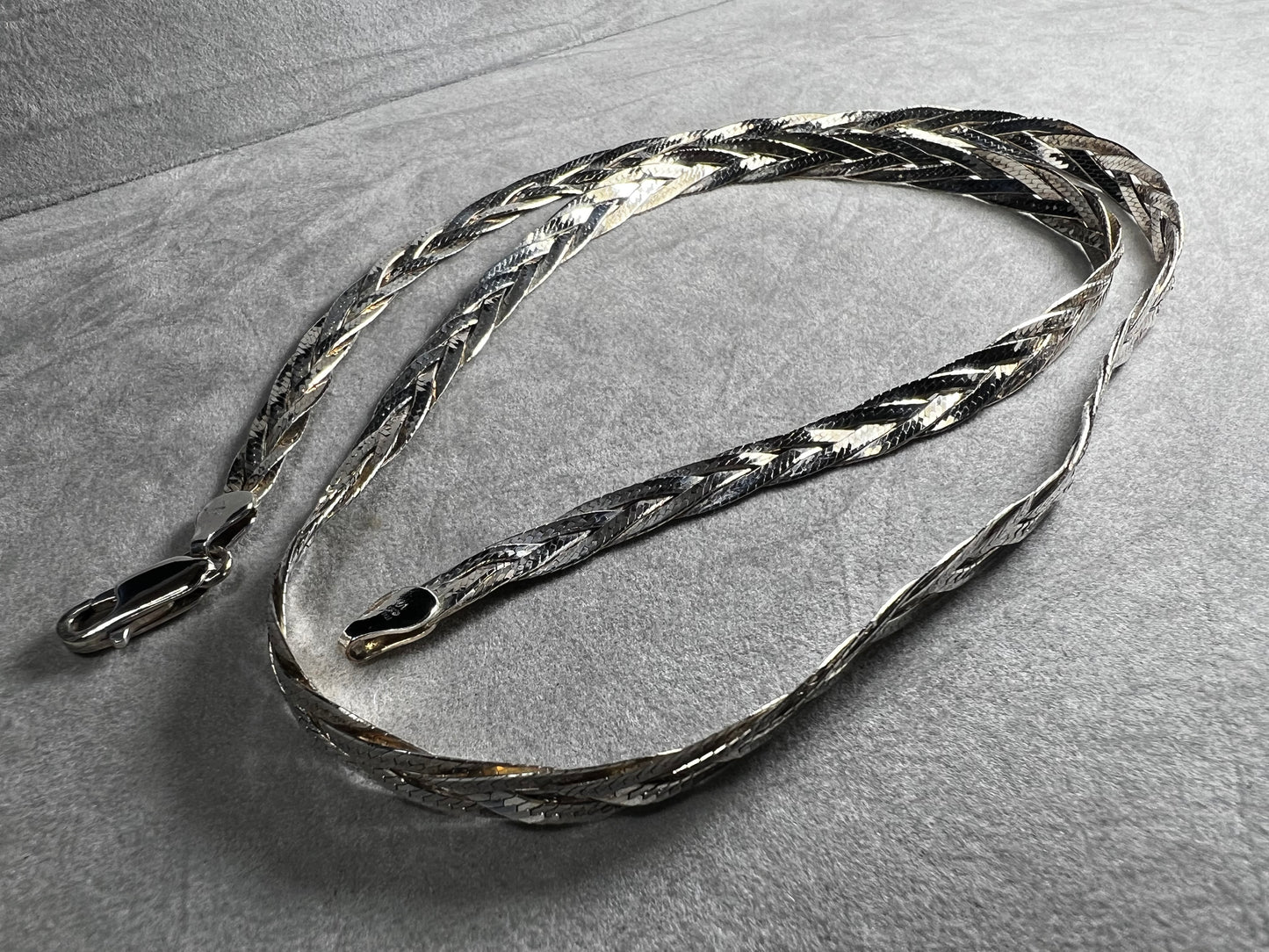 This braided sterling silver necklace is tough enough to hold your favorite heavy pendant but stylish enough to shine all on its own.