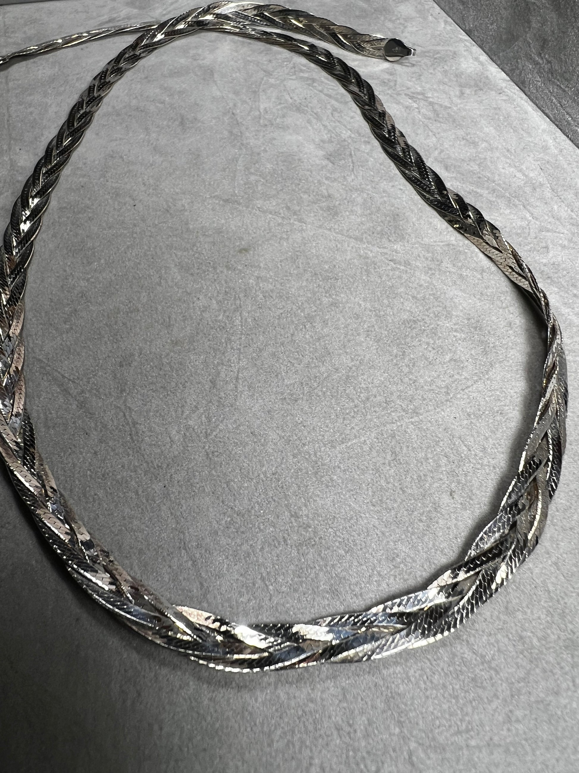 This braided sterling silver necklace is tough enough to hold your favorite heavy pendant but stylish enough to shine all on its own.
