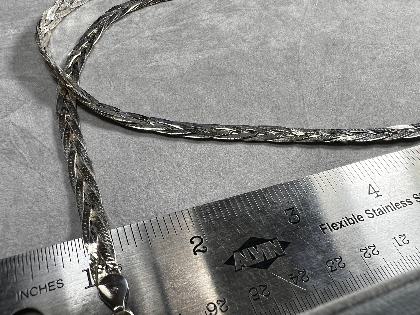 This braided sterling silver necklace is tough enough to hold your favorite heavy pendant but stylish enough to shine all on its own.