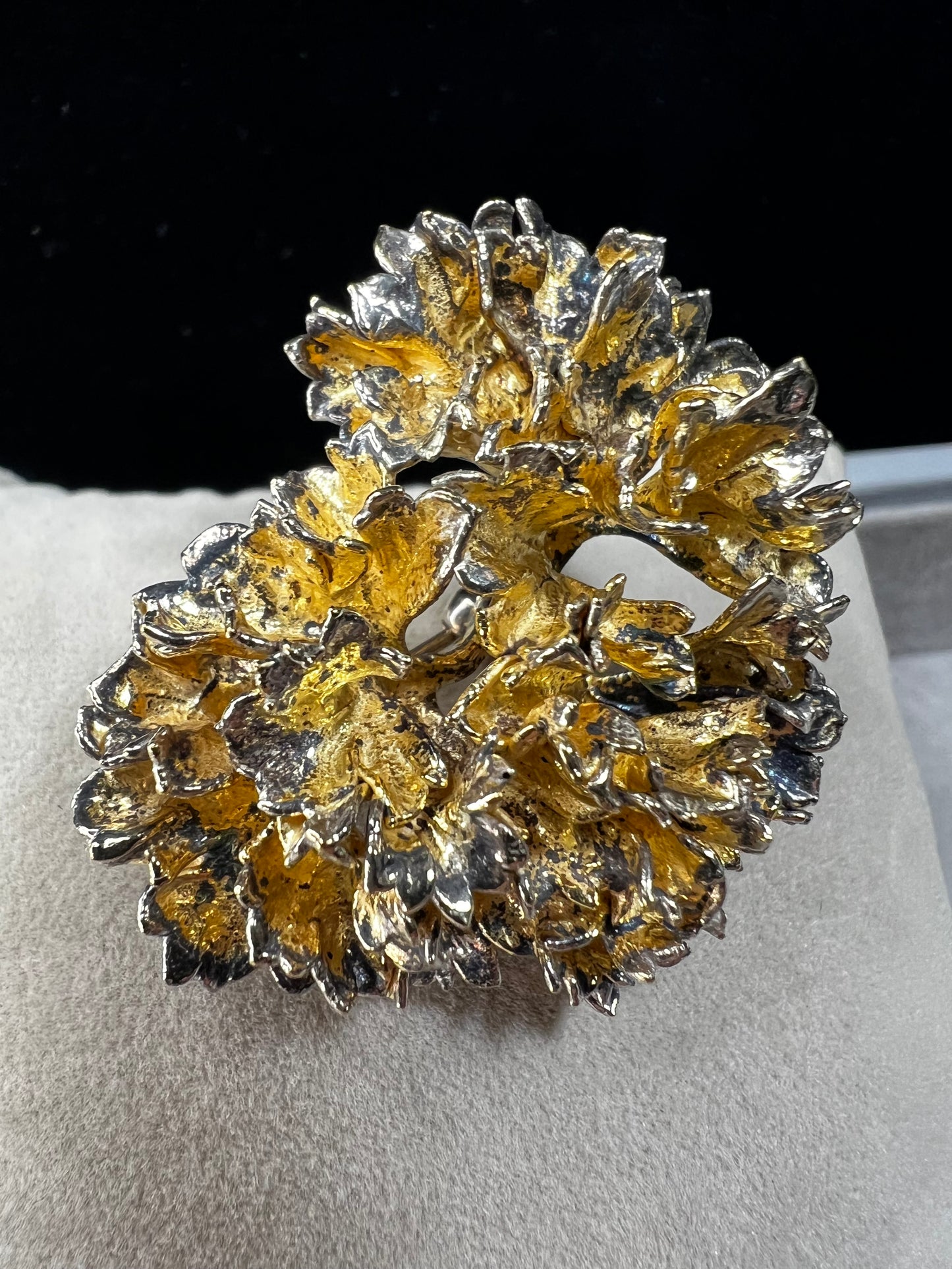 This is an elegant mid-century Flora Danica parsley brooch handcrafted in sterling silver with a warm gold-wash finish. It's a timeless accessory perfect for collectors of vintage Scandinavian jewelry or anyone who appreciates fine craftsmanship and nature-inspired design. Signed Eggert Denmark.