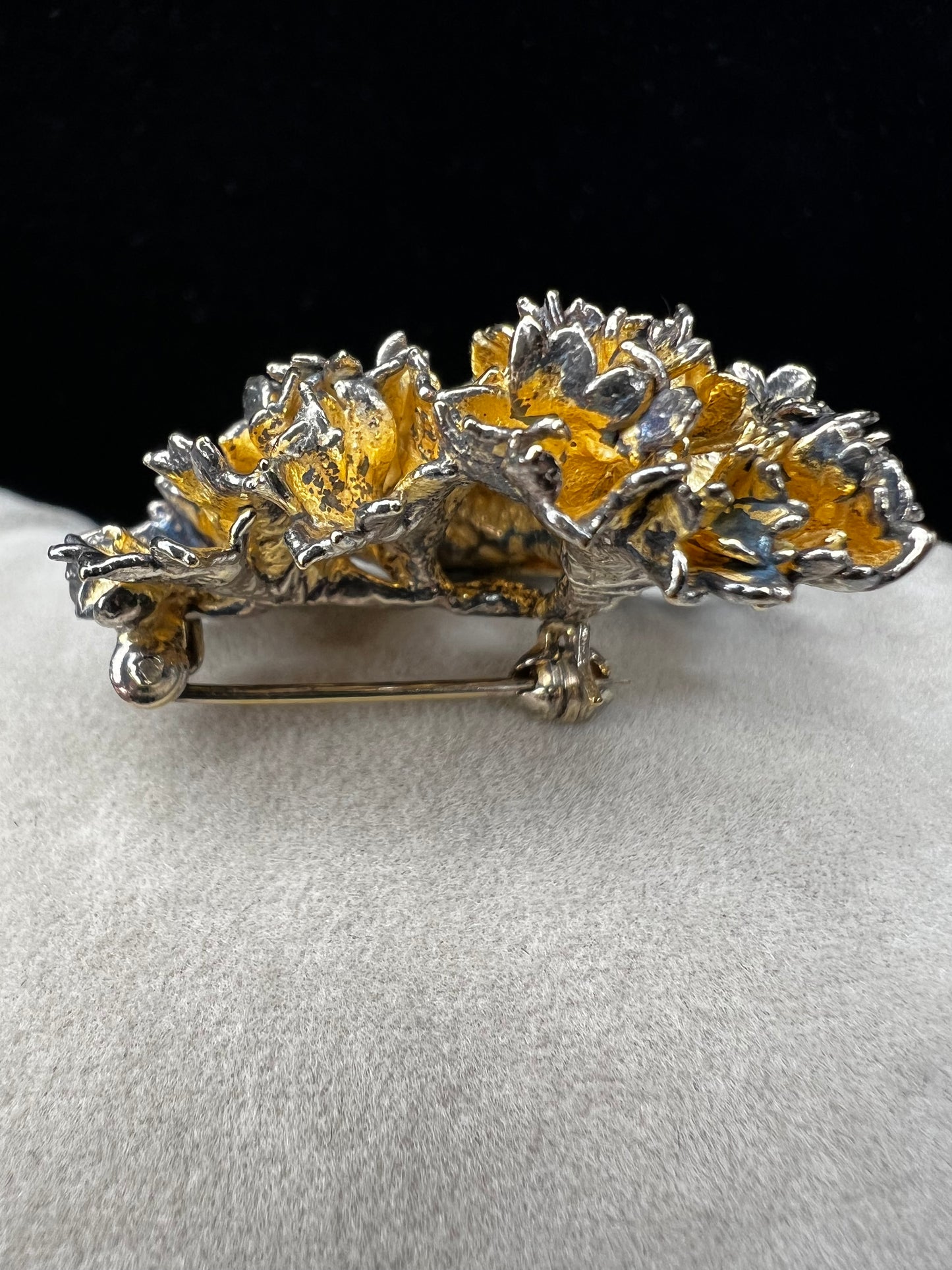 This is an elegant mid-century Flora Danica parsley brooch handcrafted in sterling silver with a warm gold-wash finish. It's a timeless accessory perfect for collectors of vintage Scandinavian jewelry or anyone who appreciates fine craftsmanship and nature-inspired design. Signed Eggert Denmark.