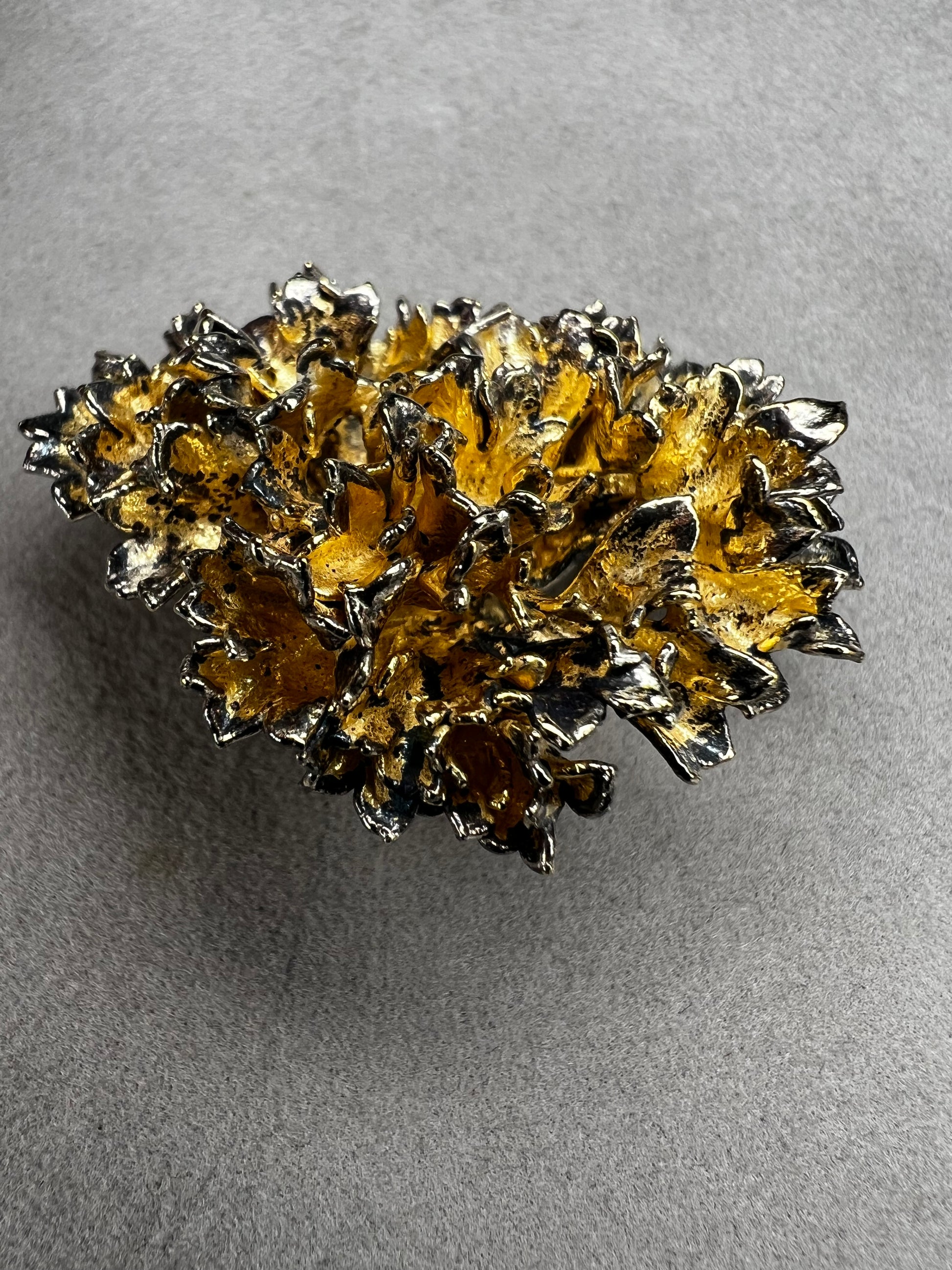 This is an elegant mid-century Flora Danica parsley brooch handcrafted in sterling silver with a warm gold-wash finish. It's a timeless accessory perfect for collectors of vintage Scandinavian jewelry or anyone who appreciates fine craftsmanship and nature-inspired design. Signed Eggert Denmark.