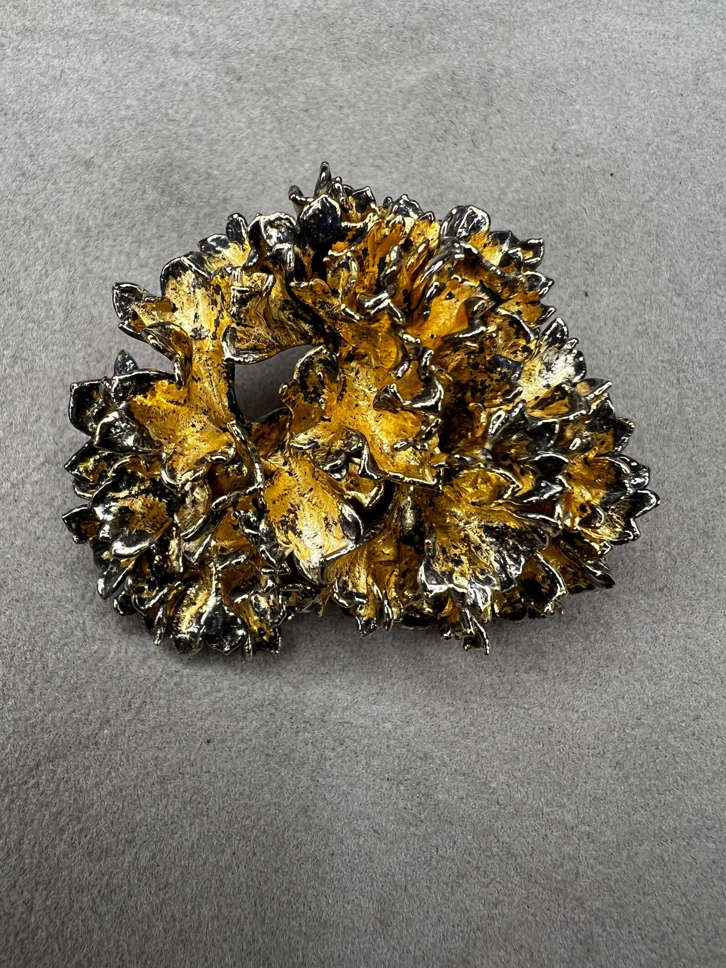 This is an elegant mid-century Flora Danica parsley brooch handcrafted in sterling silver with a warm gold-wash finish. It's a timeless accessory perfect for collectors of vintage Scandinavian jewelry or anyone who appreciates fine craftsmanship and nature-inspired design. Signed Eggert Denmark.