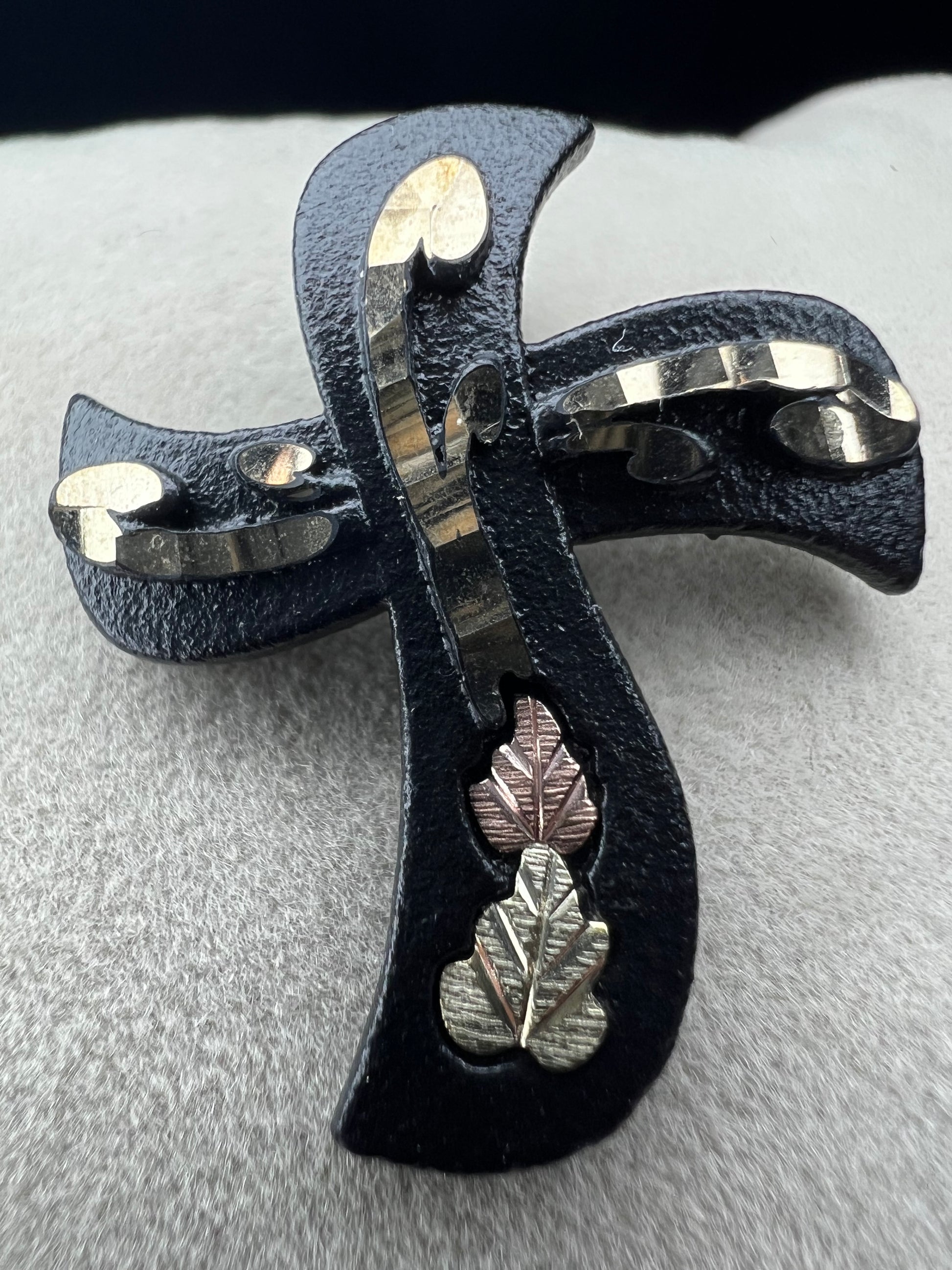 This striking pendant from Coleman Co. features a bold black powder-coated finish beautifully contrasted by warm 12 karat yellow and rose gold accents. The sophisticated blend of finishes creates a timeless piece that works as a versatile everyday accessory or a meaningful gift for someone special.