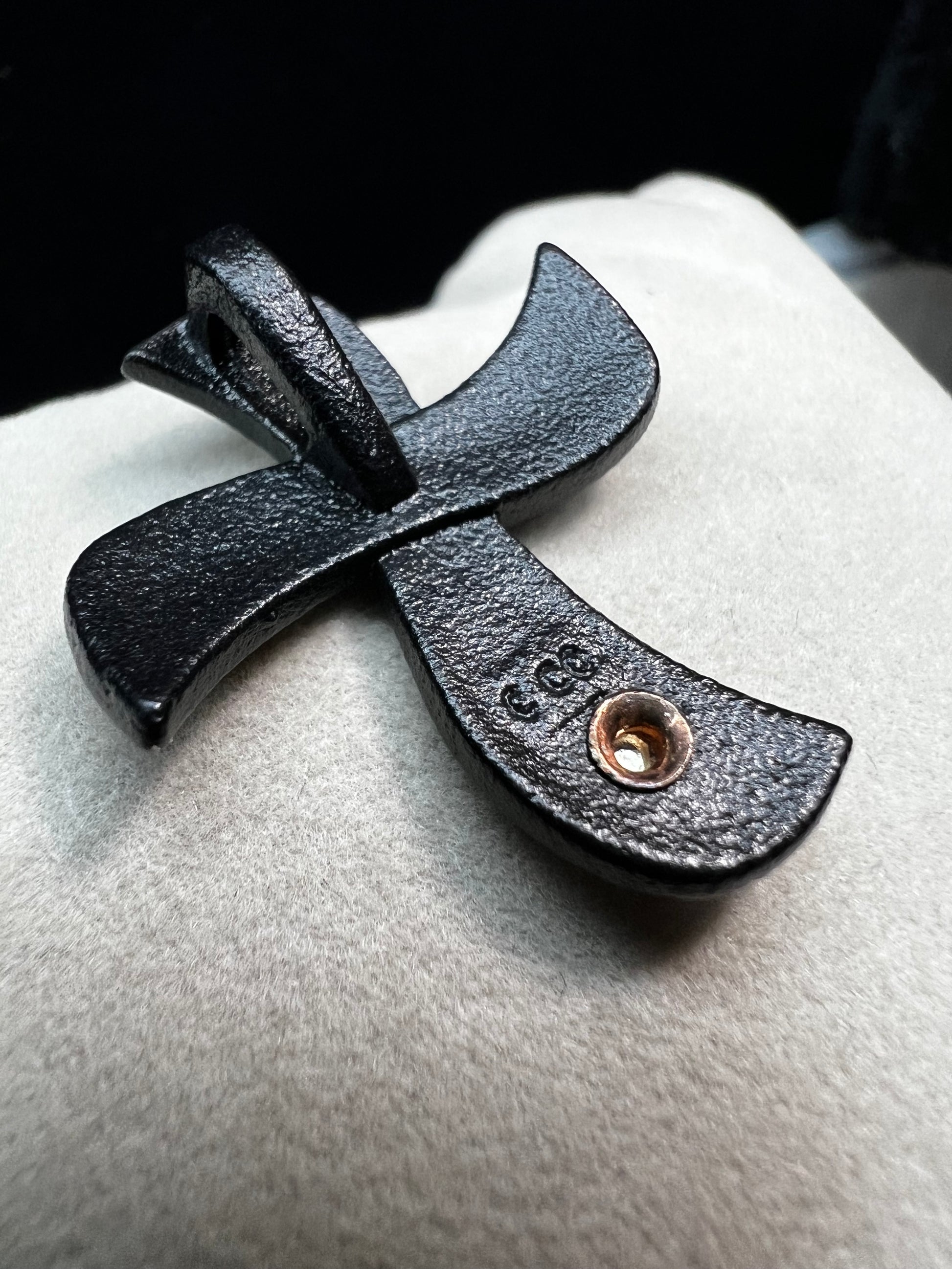 This striking pendant from Coleman Co. features a bold black powder-coated finish beautifully contrasted by warm 12 karat yellow and rose gold accents. The sophisticated blend of finishes creates a timeless piece that works as a versatile everyday accessory or a meaningful gift for someone special.