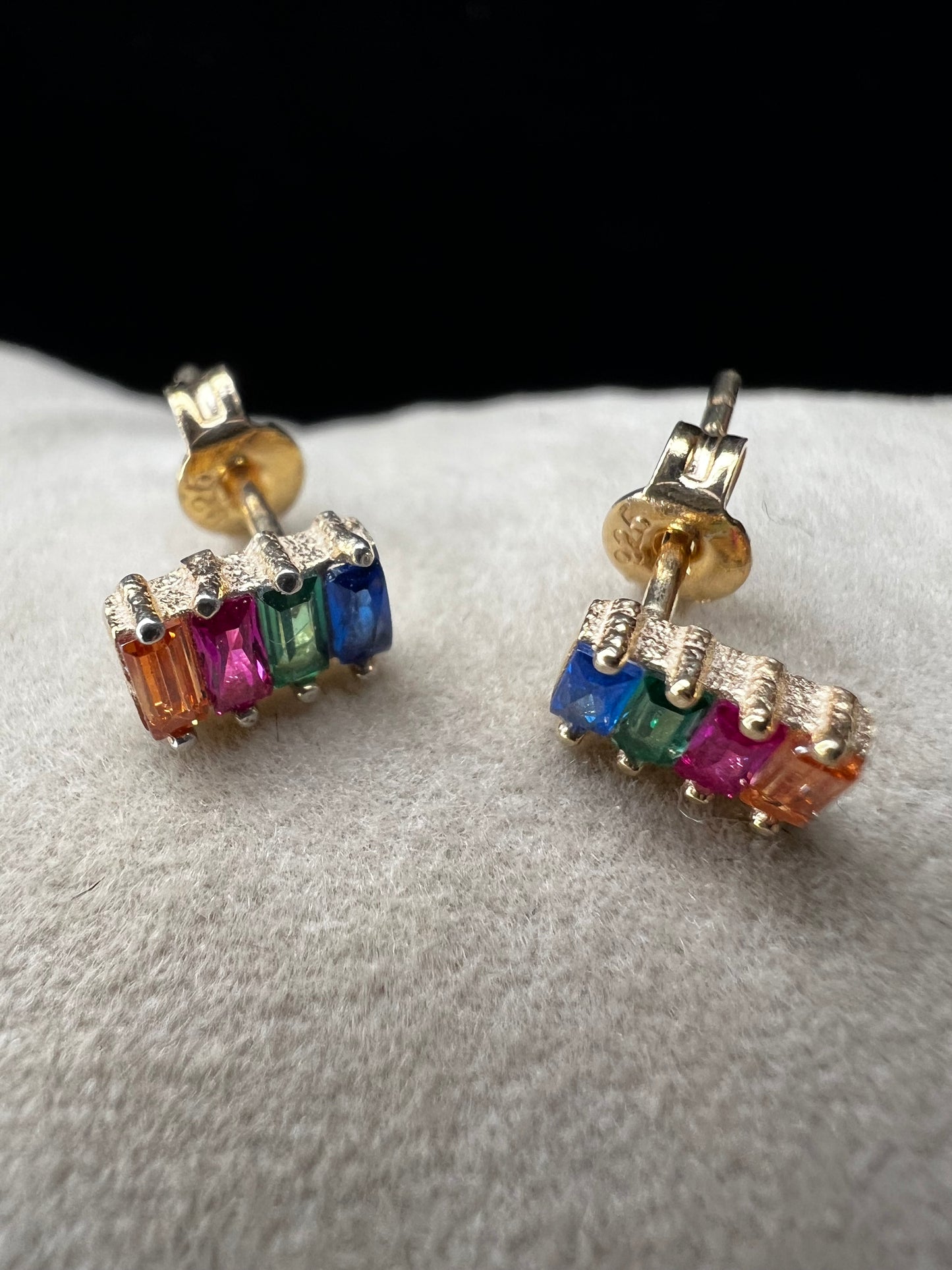 Elevate your everyday look with these stunning sterling silver earrings. They feature vibrant multi-colored stones set against a luxurious gold overlay. The perfect blend of elegance and versatility, these earrings add a pop of color and sophistication to any outfit. Crafted with quality materials, they're ideal for both casual wear and special occasions.