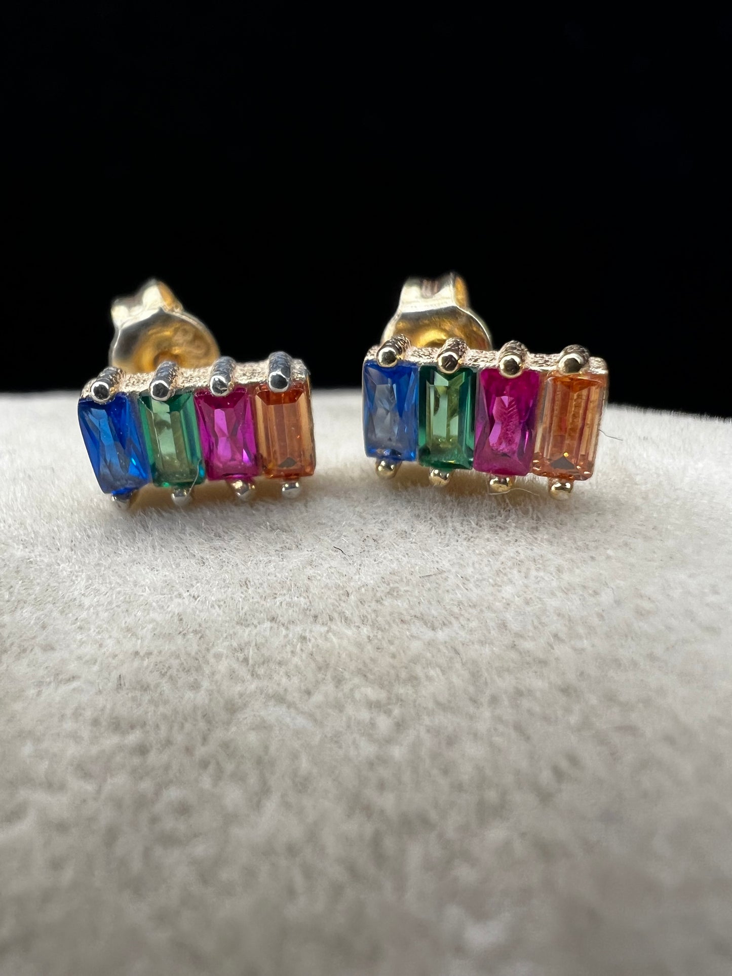 Elevate your everyday look with these stunning sterling silver earrings. They feature vibrant multi-colored stones set against a luxurious gold overlay. The perfect blend of elegance and versatility, these earrings add a pop of color and sophistication to any outfit. Crafted with quality materials, they're ideal for both casual wear and special occasions.