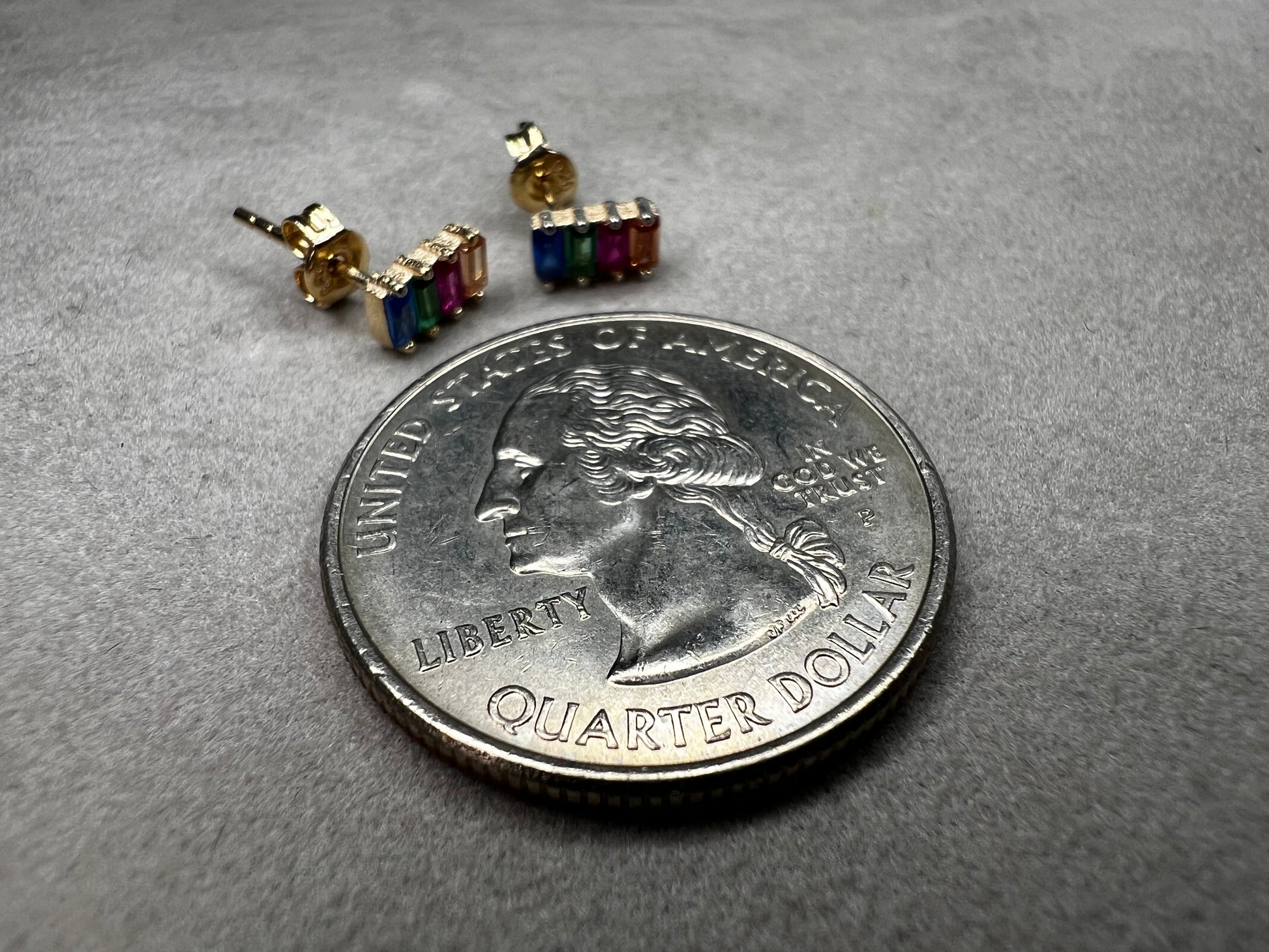 Elevate your everyday look with these stunning sterling silver earrings. They feature vibrant multi-colored stones set against a luxurious gold overlay. The perfect blend of elegance and versatility, these earrings add a pop of color and sophistication to any outfit. Crafted with quality materials, they're ideal for both casual wear and special occasions.