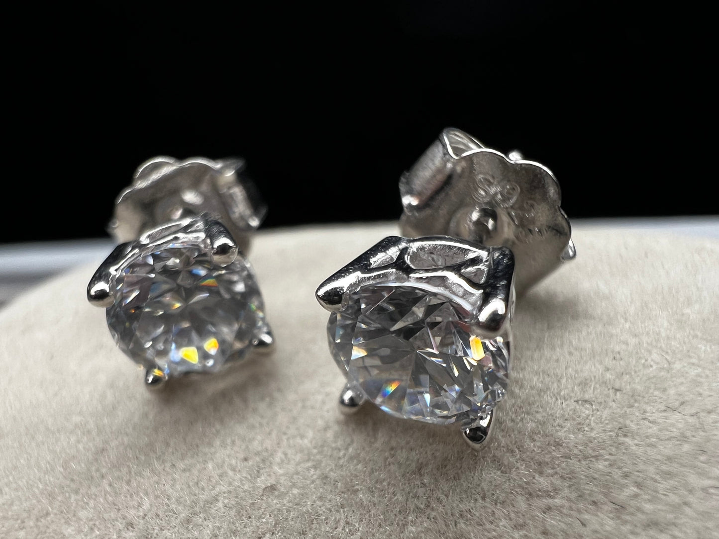 These sterling silver and CZ earrings combine timeless elegance with modern sparkle. Each piece features a generous 6 mm cubic zirconia stone set in premium sterling silver, delivering brilliant shine at a fraction of the cost of diamonds. Perfect for everyday wear or special occasions, these earrings offer versatile style that complements any wardrobe.