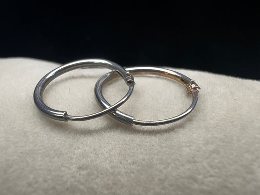 These hoop earrings offer a timeless and refined accessory choice. Crafted from high-quality sterling silver, they provide durability and a polished finish that complements any outfit.