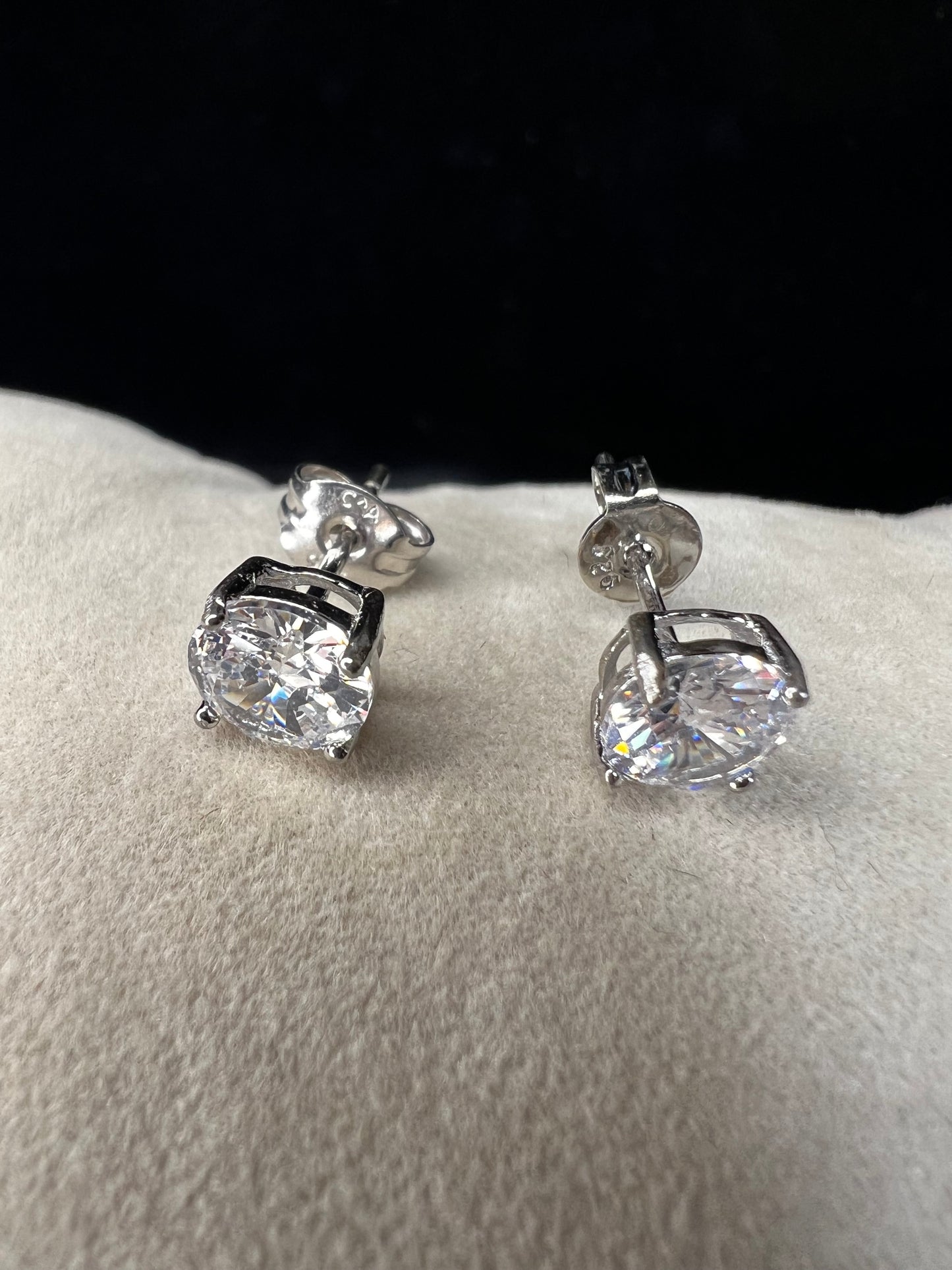 Elevate your everyday look with these timeless sterling silver 6 mm CZ stud earrings. Each pair features brilliant cubic zirconia stones that sparkle with diamond-like clarity. The perfect size for versatile wear ... understated enough for the office, radiant enough for special occasions.