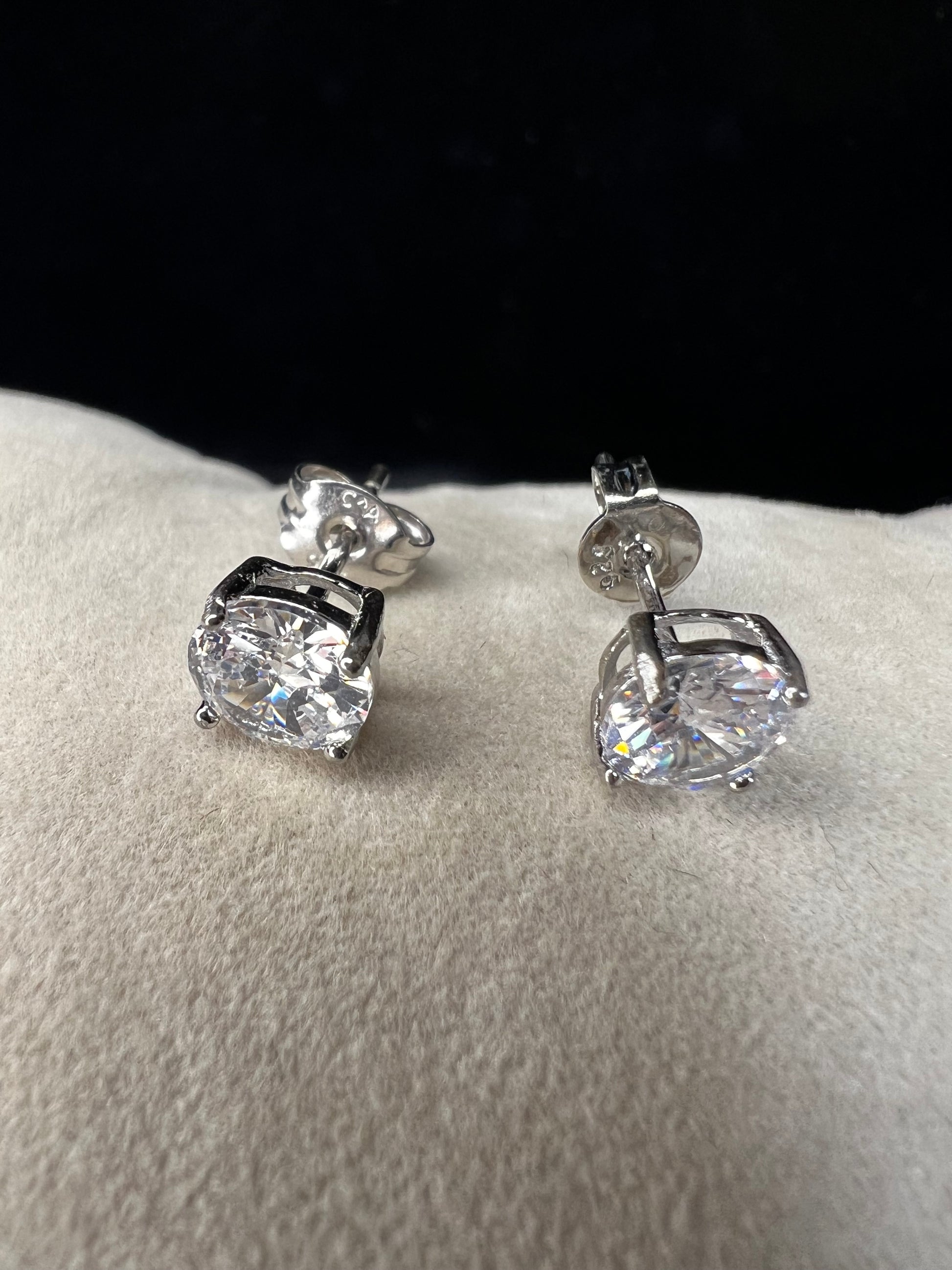 Elevate your everyday look with these timeless sterling silver 6 mm CZ stud earrings. Each pair features brilliant cubic zirconia stones that sparkle with diamond-like clarity. The perfect size for versatile wear ... understated enough for the office, radiant enough for special occasions.