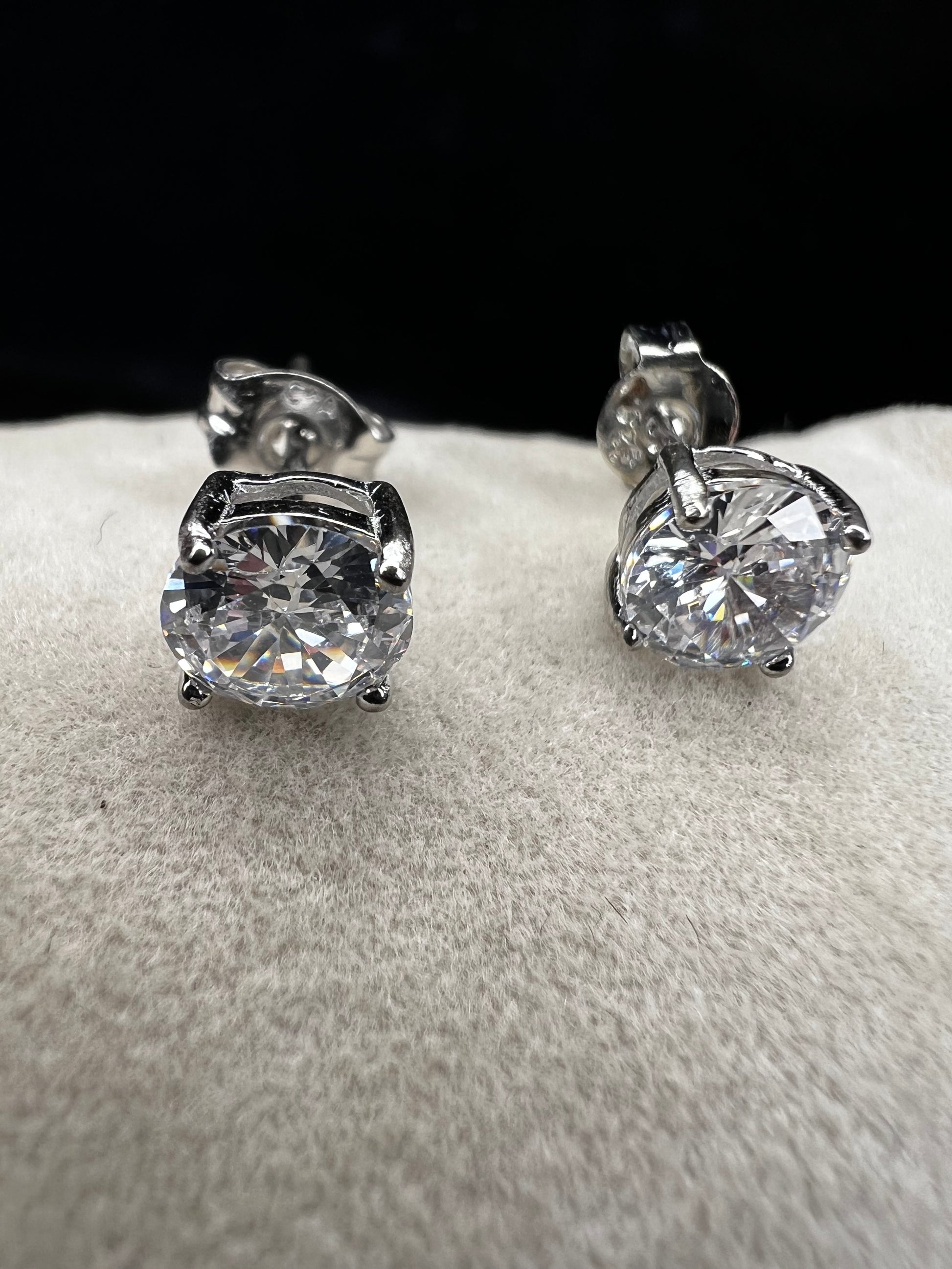Elevate your everyday look with these timeless sterling silver 6 mm CZ stud earrings. Each pair features brilliant cubic zirconia stones that sparkle with diamond-like clarity. The perfect size for versatile wear ... understated enough for the office, radiant enough for special occasions.