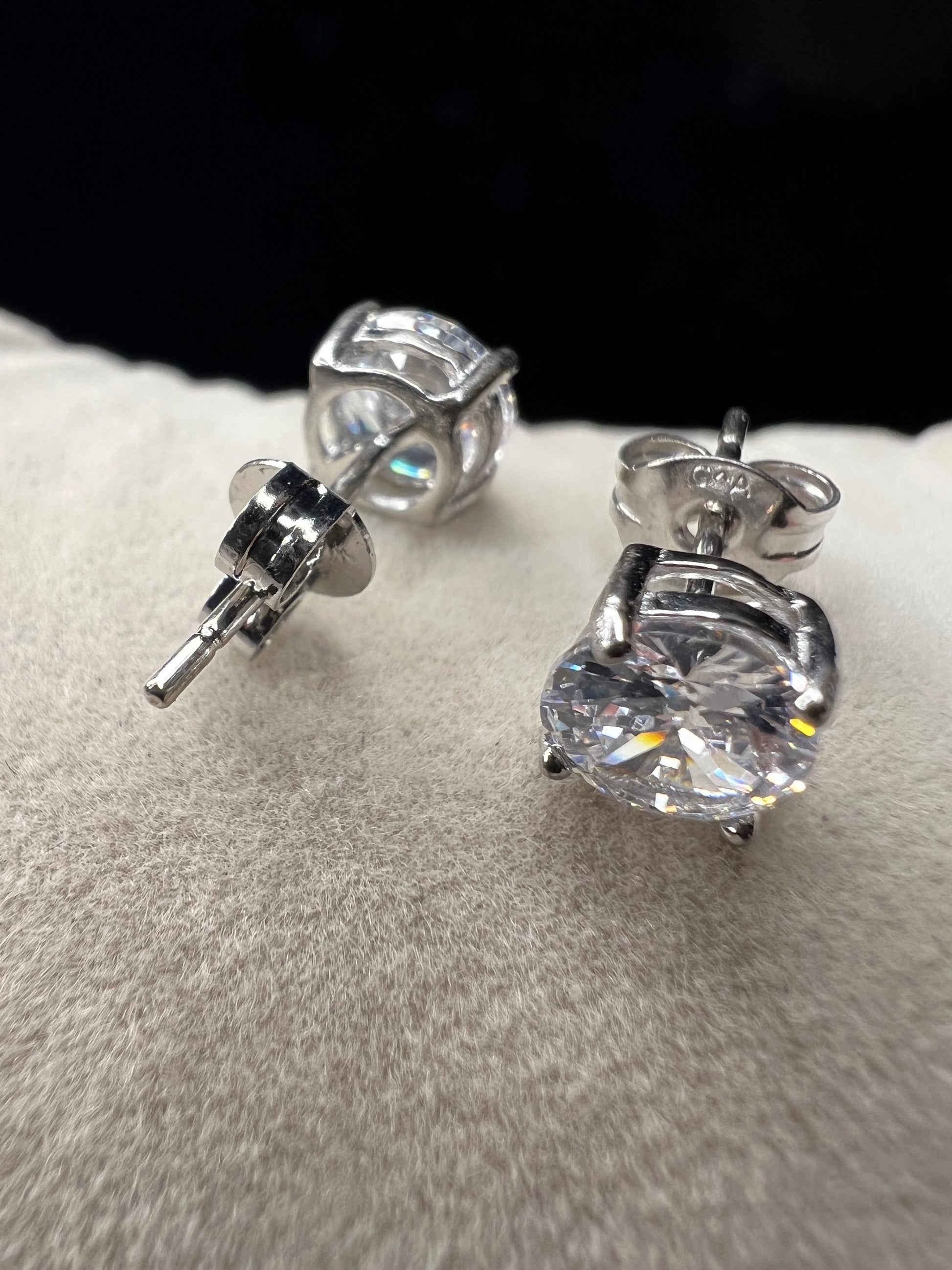 Elevate your everyday look with these timeless sterling silver 6 mm CZ stud earrings. Each pair features brilliant cubic zirconia stones that sparkle with diamond-like clarity. The perfect size for versatile wear ... understated enough for the office, radiant enough for special occasions.