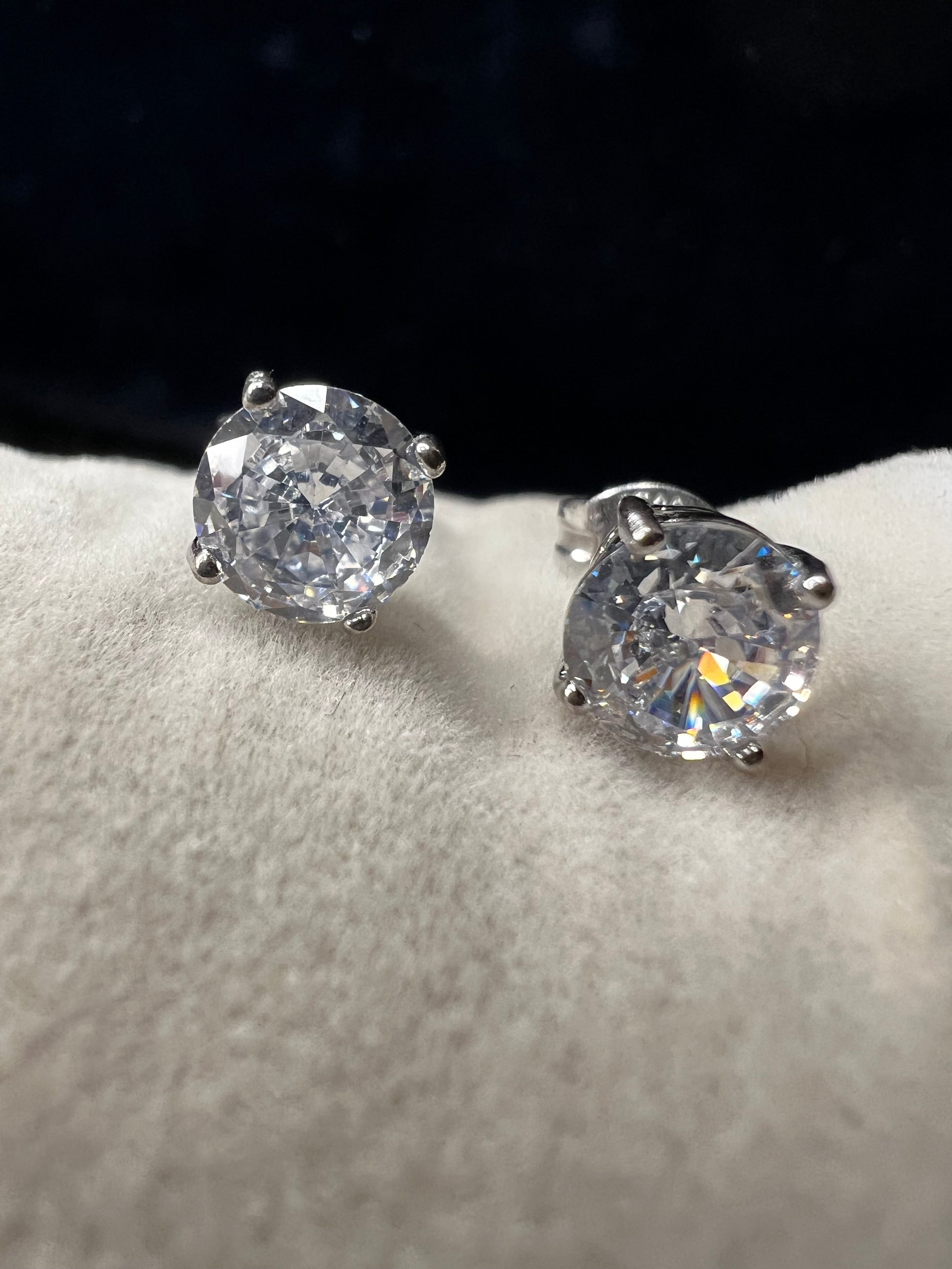 Elevate your everyday look with these timeless sterling silver 6 mm CZ stud earrings. Each pair features brilliant cubic zirconia stones that sparkle with diamond-like clarity. The perfect size for versatile wear ... understated enough for the office, radiant enough for special occasions.
