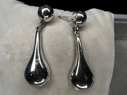 These vintage earrings showcase authentic Taxco craftsmanship, featuring sterling silver with distinctive hallmarks. Designed with elegant ball studs and graceful teardrop shapes, they offer a timeless accessory that reflects expert artistry and quality.
