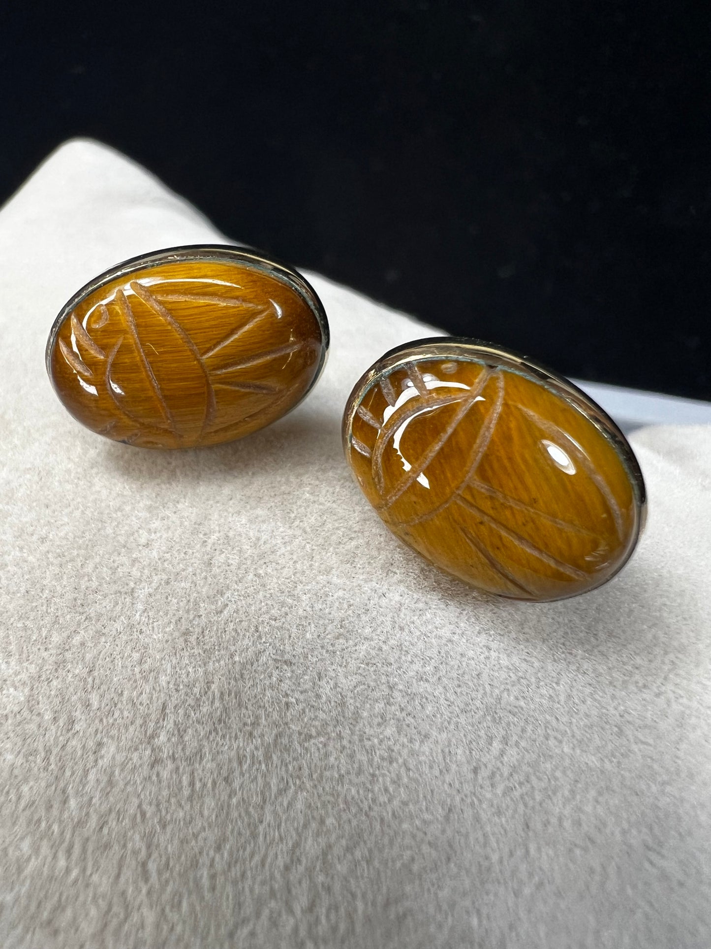 These gold-filled earrings showcase tiger's eye scarabs, combining timeless elegance with natural beauty. The warm tones of tiger's eye add depth and sophistication, making these a versatile accessory that enhances both casual and formal looks.