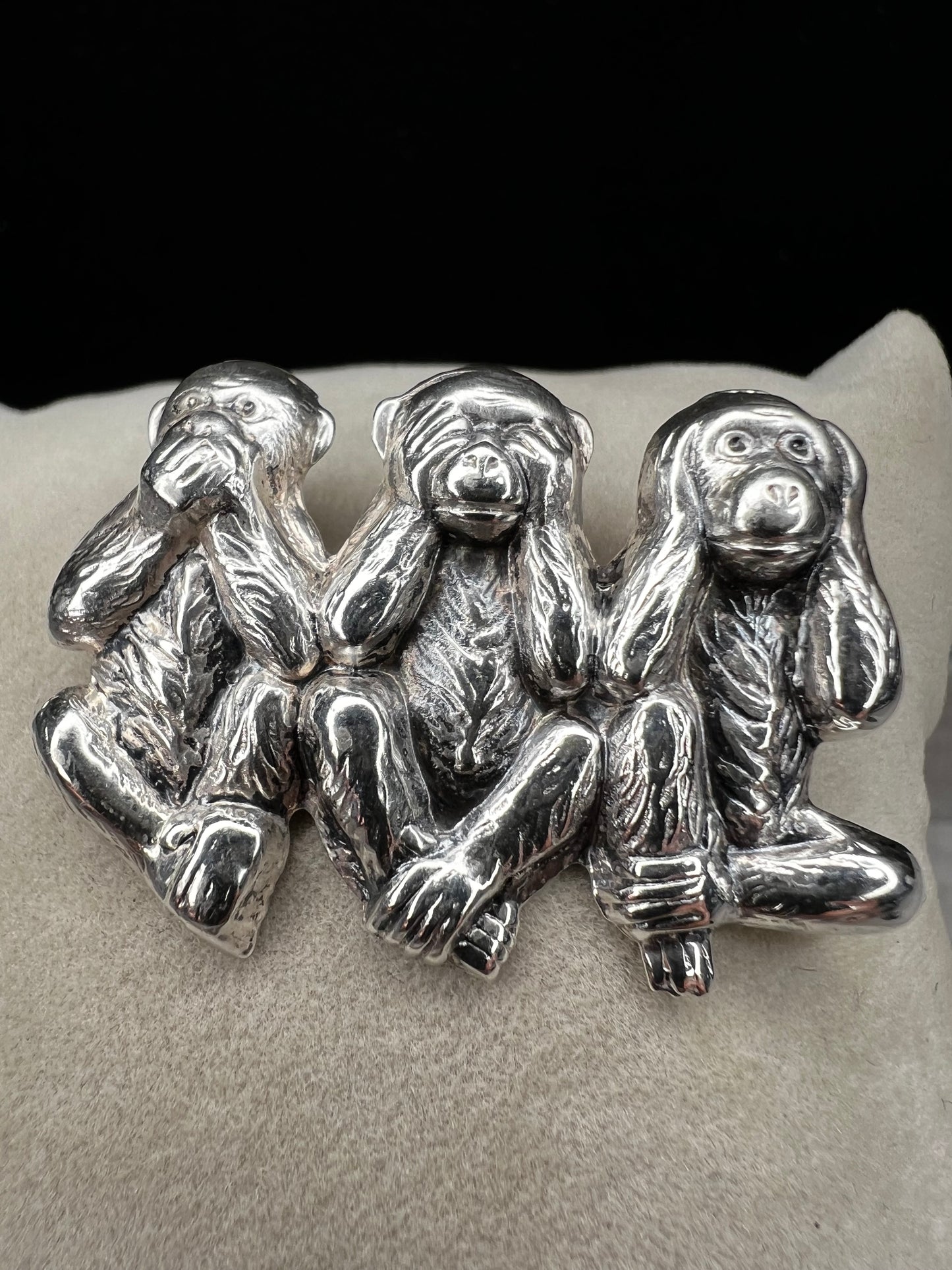 This charming vintage Beau Sterling Silver brooch captures the iconic "see no evil, speak no evil, hear no evil" trio of monkeys in timeless sterling silver. A classic symbol of wisdom and playfulness, this piece adds character to any collection. Perfect for vintage jewelry enthusiasts or as a meaningful gift, it combines nostalgic appeal with quality craftsmanship. The detailed design and sterling silver construction make it a versatile accessory for both everyday wear and special occasions.