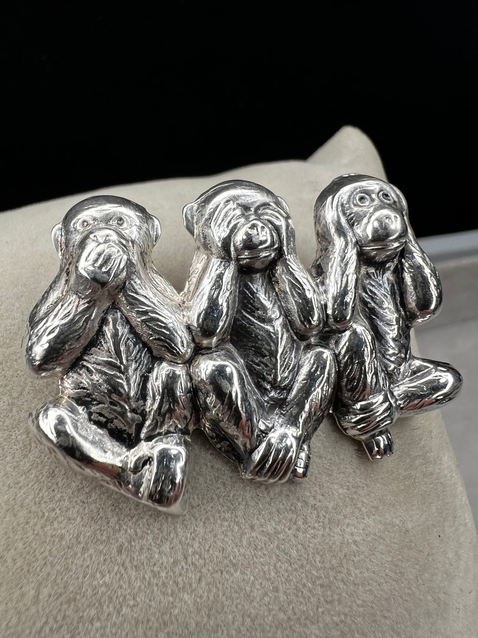 This charming vintage Beau Sterling Silver brooch captures the iconic "see no evil, speak no evil, hear no evil" trio of monkeys in timeless sterling silver. A classic symbol of wisdom and playfulness, this piece adds character to any collection. Perfect for vintage jewelry enthusiasts or as a meaningful gift, it combines nostalgic appeal with quality craftsmanship. The detailed design and sterling silver construction make it a versatile accessory for both everyday wear and special occasions.