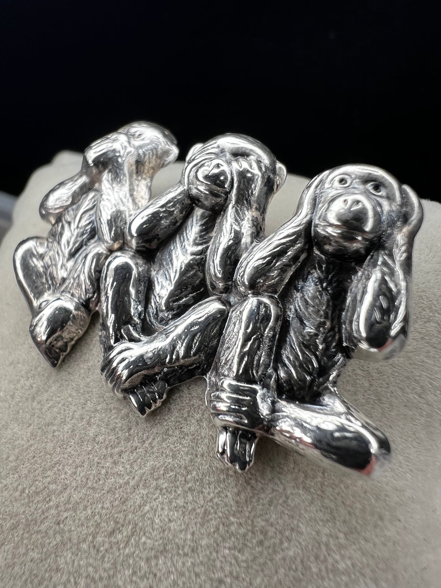This charming vintage Beau Sterling Silver brooch captures the iconic "see no evil, speak no evil, hear no evil" trio of monkeys in timeless sterling silver. A classic symbol of wisdom and playfulness, this piece adds character to any collection. Perfect for vintage jewelry enthusiasts or as a meaningful gift, it combines nostalgic appeal with quality craftsmanship. The detailed design and sterling silver construction make it a versatile accessory for both everyday wear and special occasions.