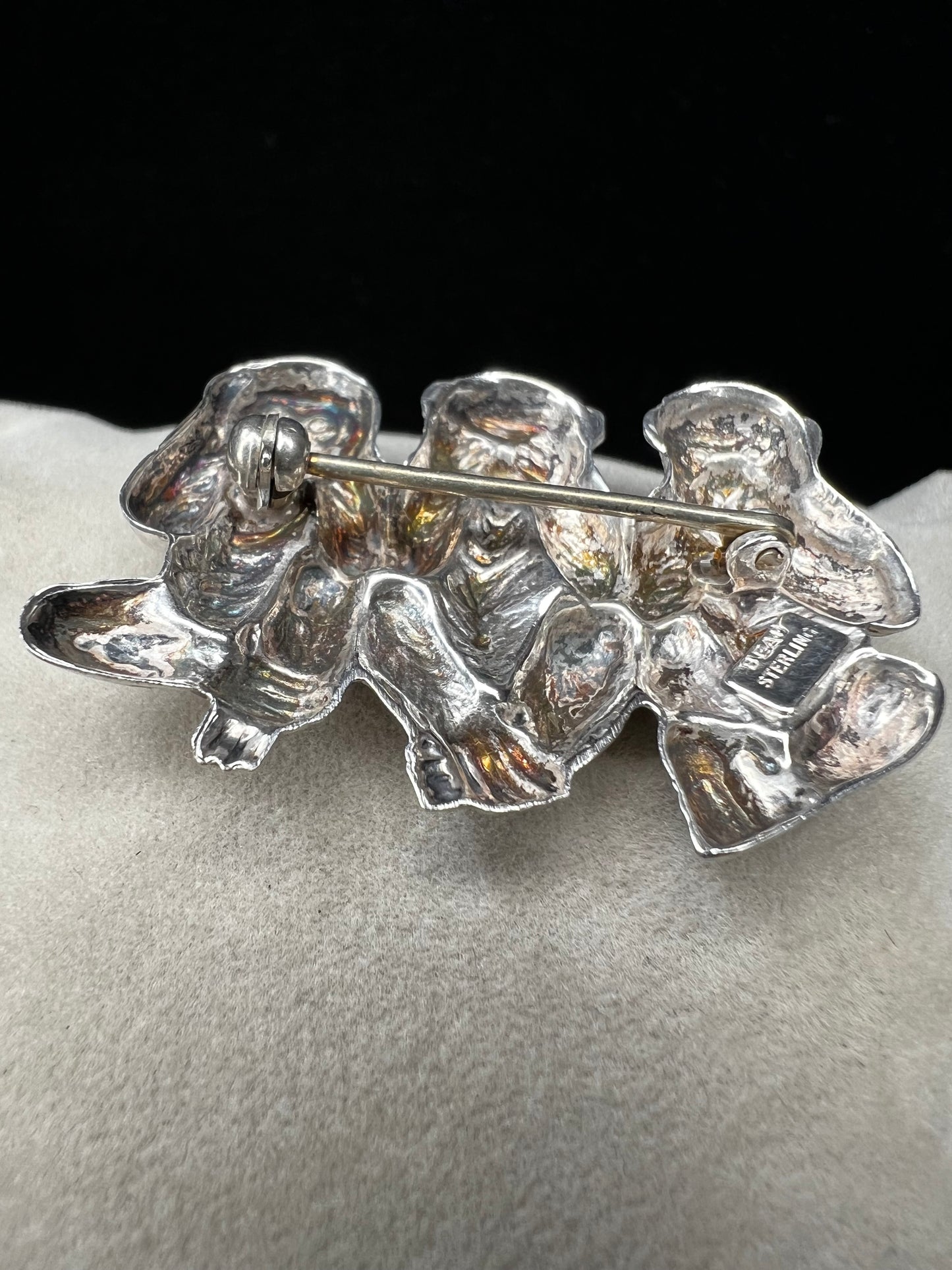 This charming vintage Beau Sterling Silver brooch captures the iconic "see no evil, speak no evil, hear no evil" trio of monkeys in timeless sterling silver. A classic symbol of wisdom and playfulness, this piece adds character to any collection. Perfect for vintage jewelry enthusiasts or as a meaningful gift, it combines nostalgic appeal with quality craftsmanship. The detailed design and sterling silver construction make it a versatile accessory for both everyday wear and special occasions.