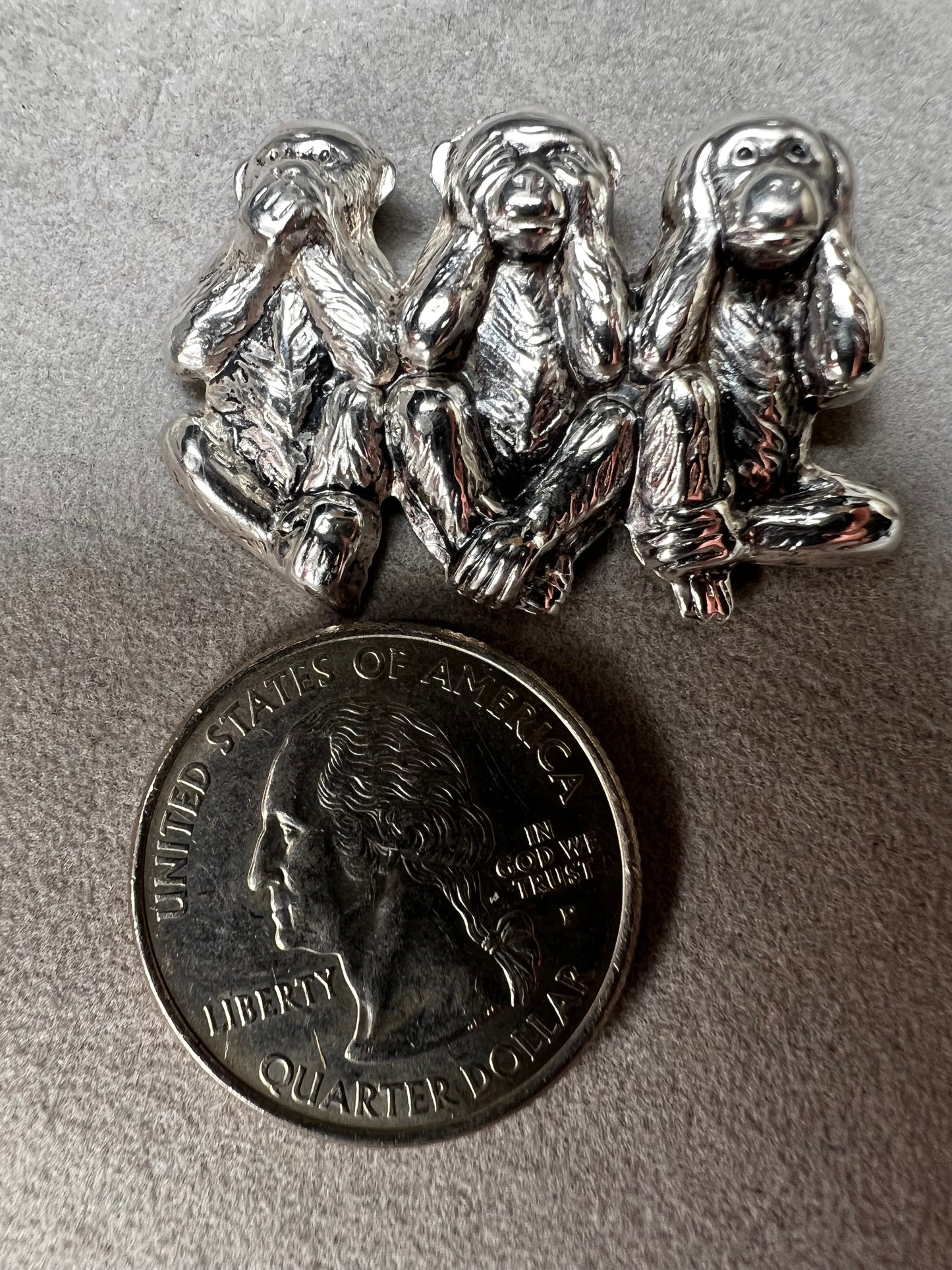 This charming vintage Beau Sterling Silver brooch captures the iconic "see no evil, speak no evil, hear no evil" trio of monkeys in timeless sterling silver. A classic symbol of wisdom and playfulness, this piece adds character to any collection. Perfect for vintage jewelry enthusiasts or as a meaningful gift, it combines nostalgic appeal with quality craftsmanship. The detailed design and sterling silver construction make it a versatile accessory for both everyday wear and special occasions.
