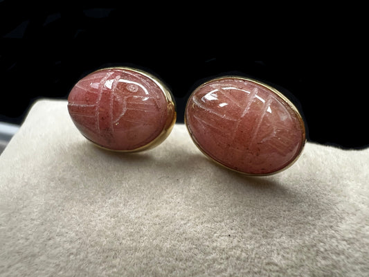 These carved scarab stones, likely pink aventurine, are set in warm 14 karat gold-filled settings and crafted into a timeless pair of post earrings.