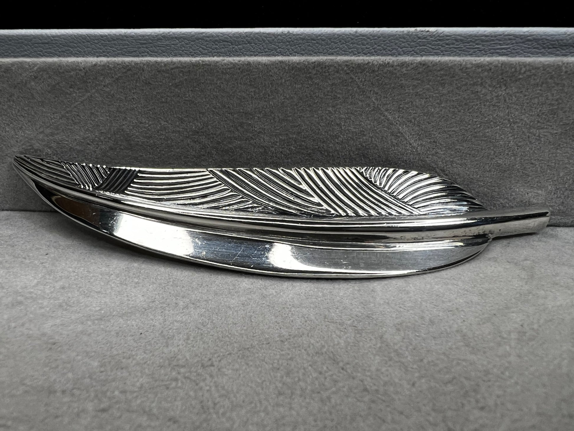 This Danecraft sterling silver brooch features an elegant leaf design measuring just over 4 inches, making it a standout accessory.
