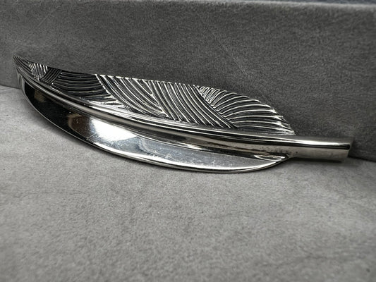This Danecraft sterling silver brooch features an elegant leaf design measuring just over 4 inches, making it a standout accessory.