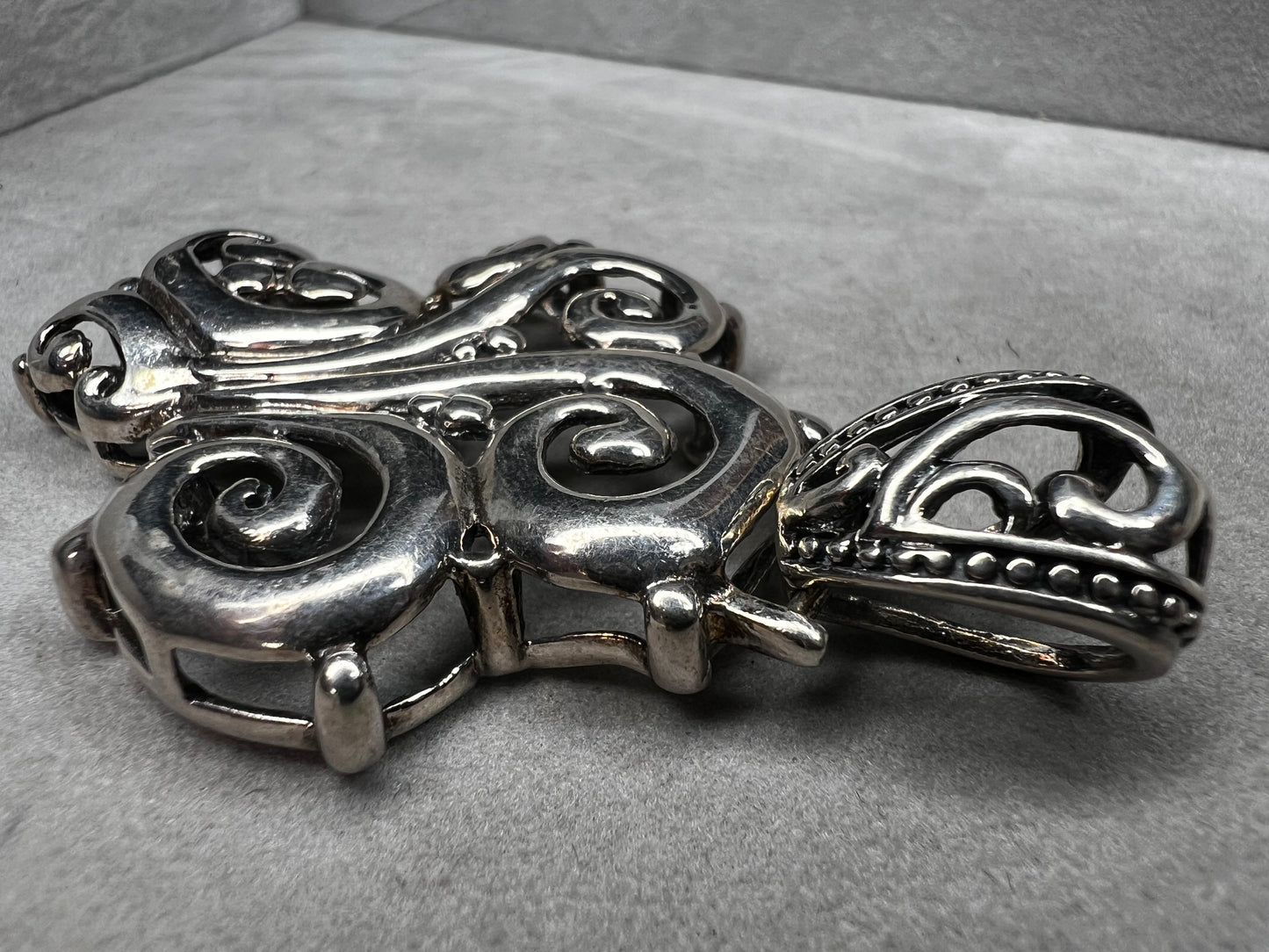 This large 2.5" sterling silver crucifix pendant combines boldness with elegance in its detailed craftsmanship. Its striking design makes it a meaningful statement piece, perfect for expressing faith with style and confidence.