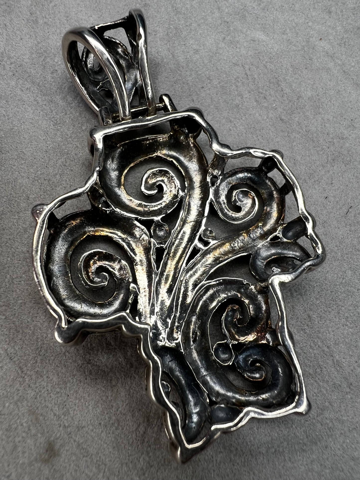 This large 2.5" sterling silver crucifix pendant combines boldness with elegance in its detailed craftsmanship. Its striking design makes it a meaningful statement piece, perfect for expressing faith with style and confidence.