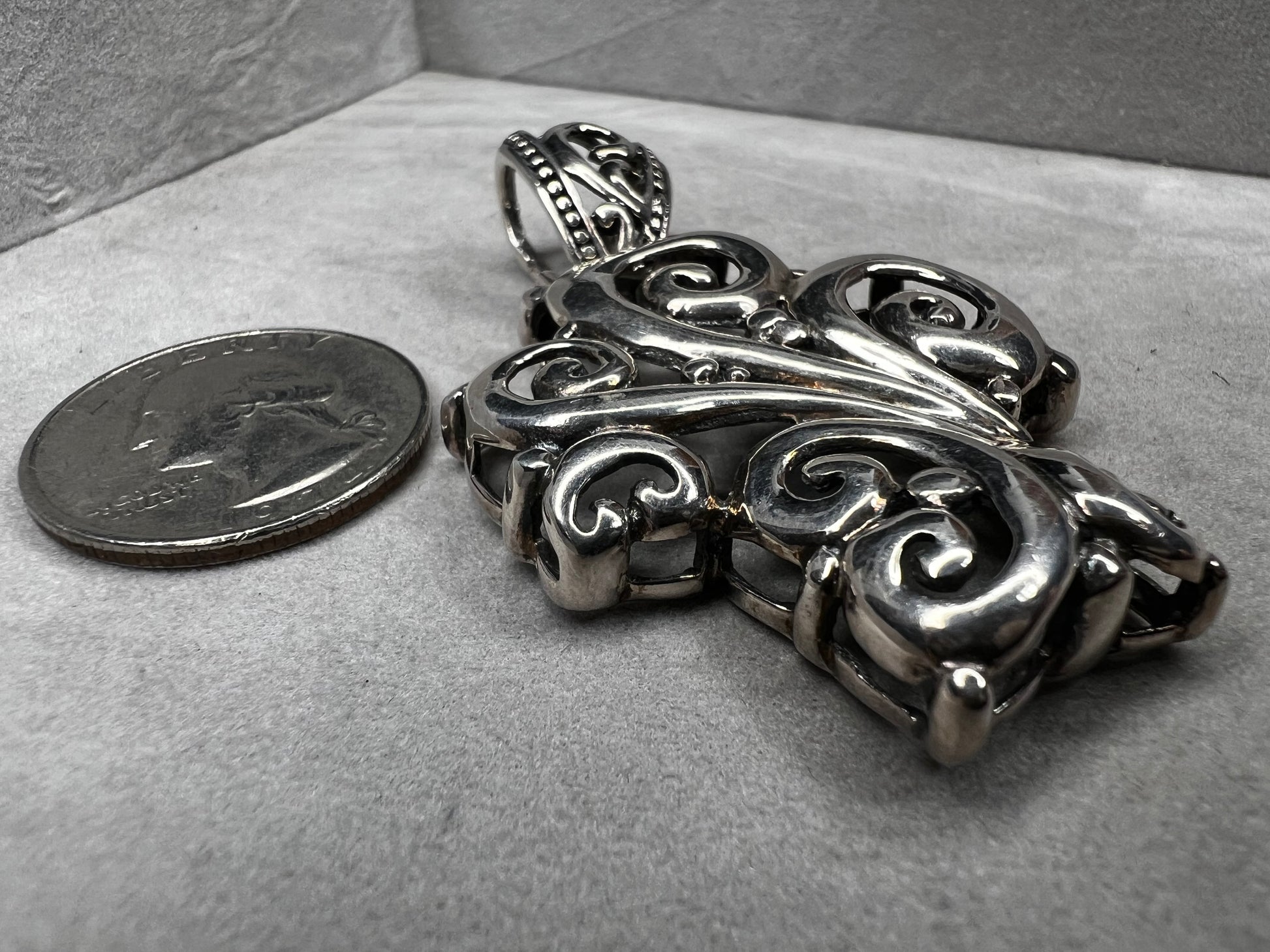 This large 2.5" sterling silver crucifix pendant combines boldness with elegance in its detailed craftsmanship. Its striking design makes it a meaningful statement piece, perfect for expressing faith with style and confidence.