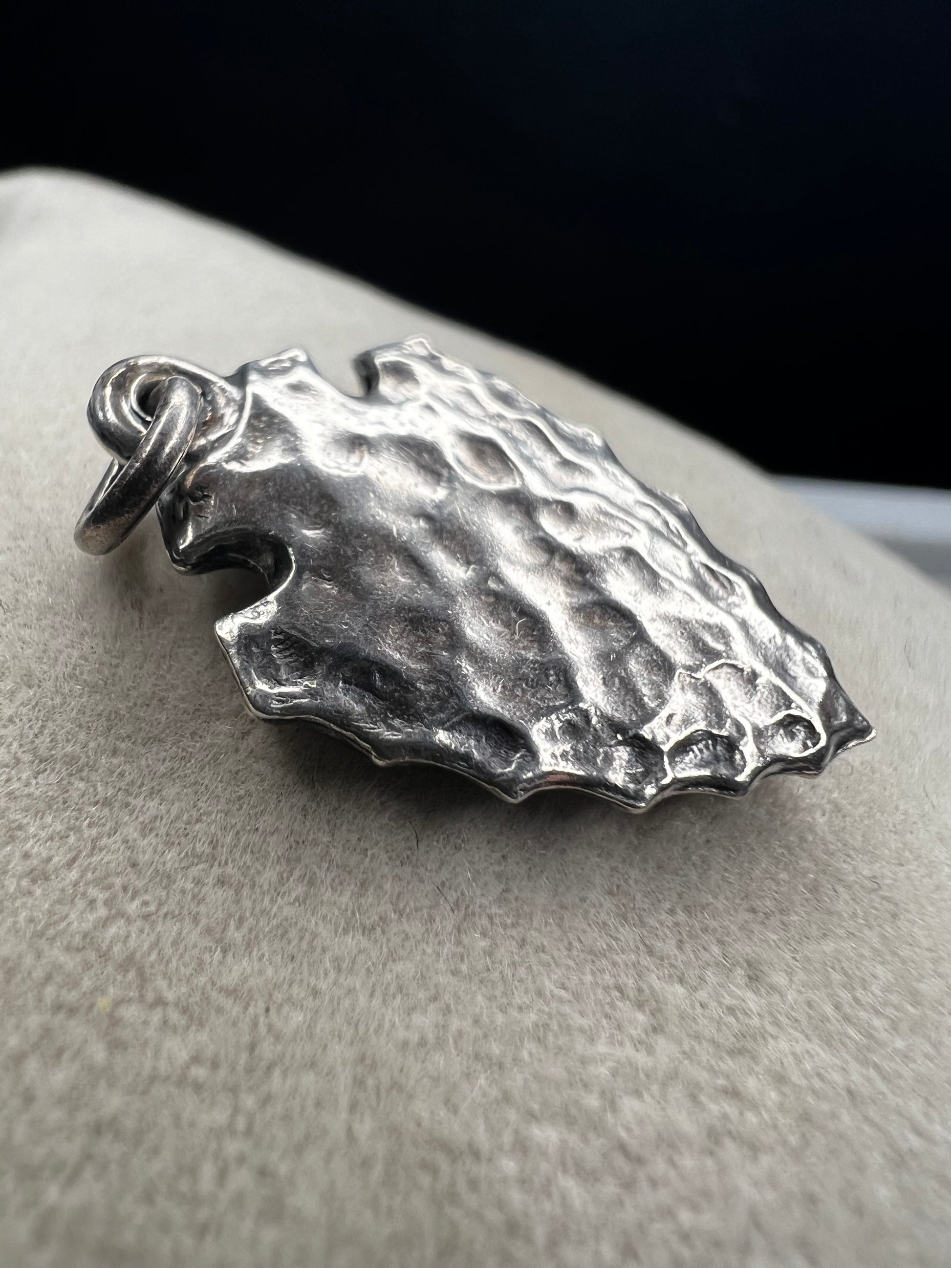 This sterling silver arrowhead, measuring 1 inch, offers versatile wear as either a charm or a pendant. Its sleek design adds a subtle touch of elegance, making it a meaningful accessory that complements any style with ease.
